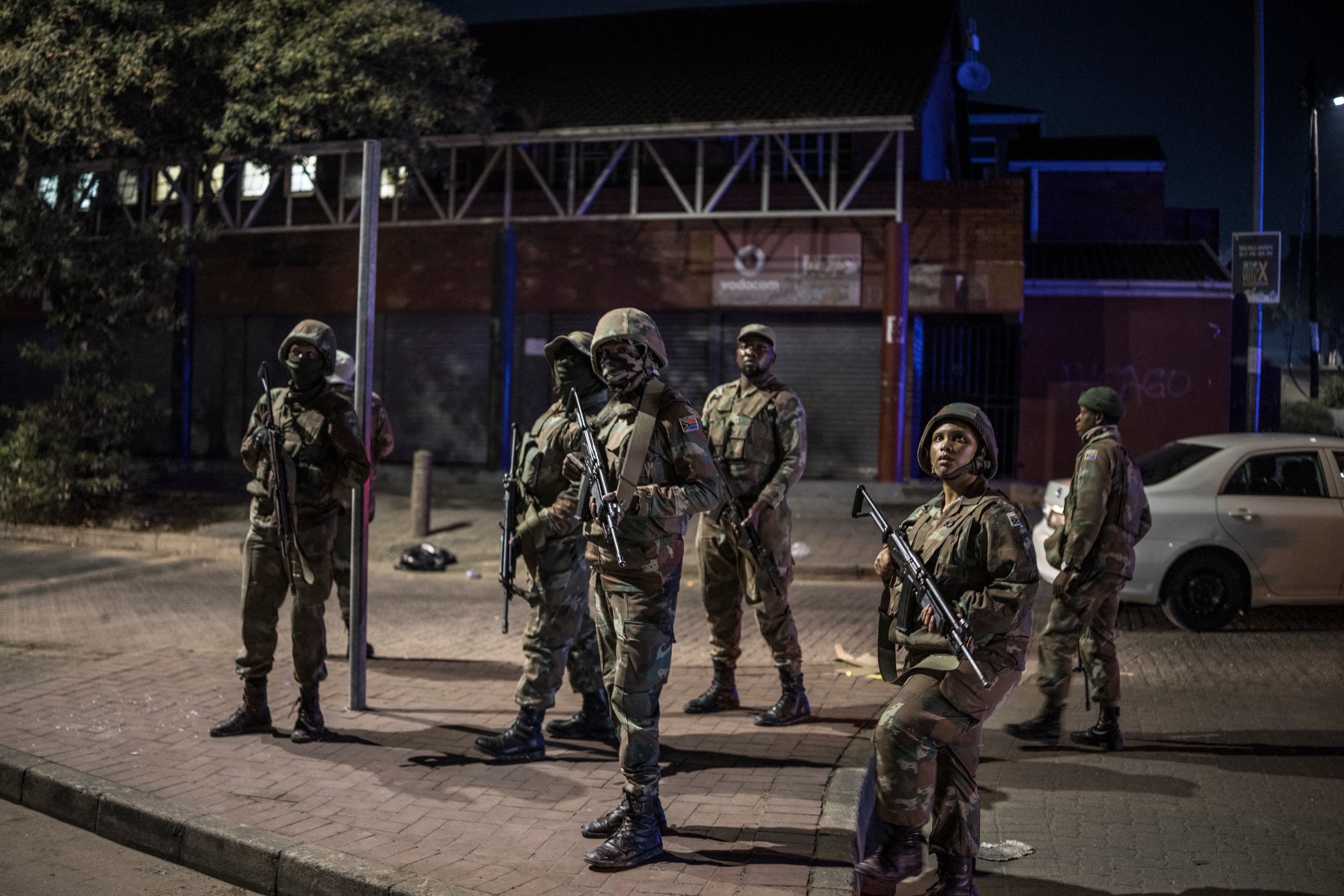 The protests have also been marked by looting. In this picture, soldiers with the South African National Defence Forces (SANDF) patrol an area where looting took place in the Umlazi area of Durban