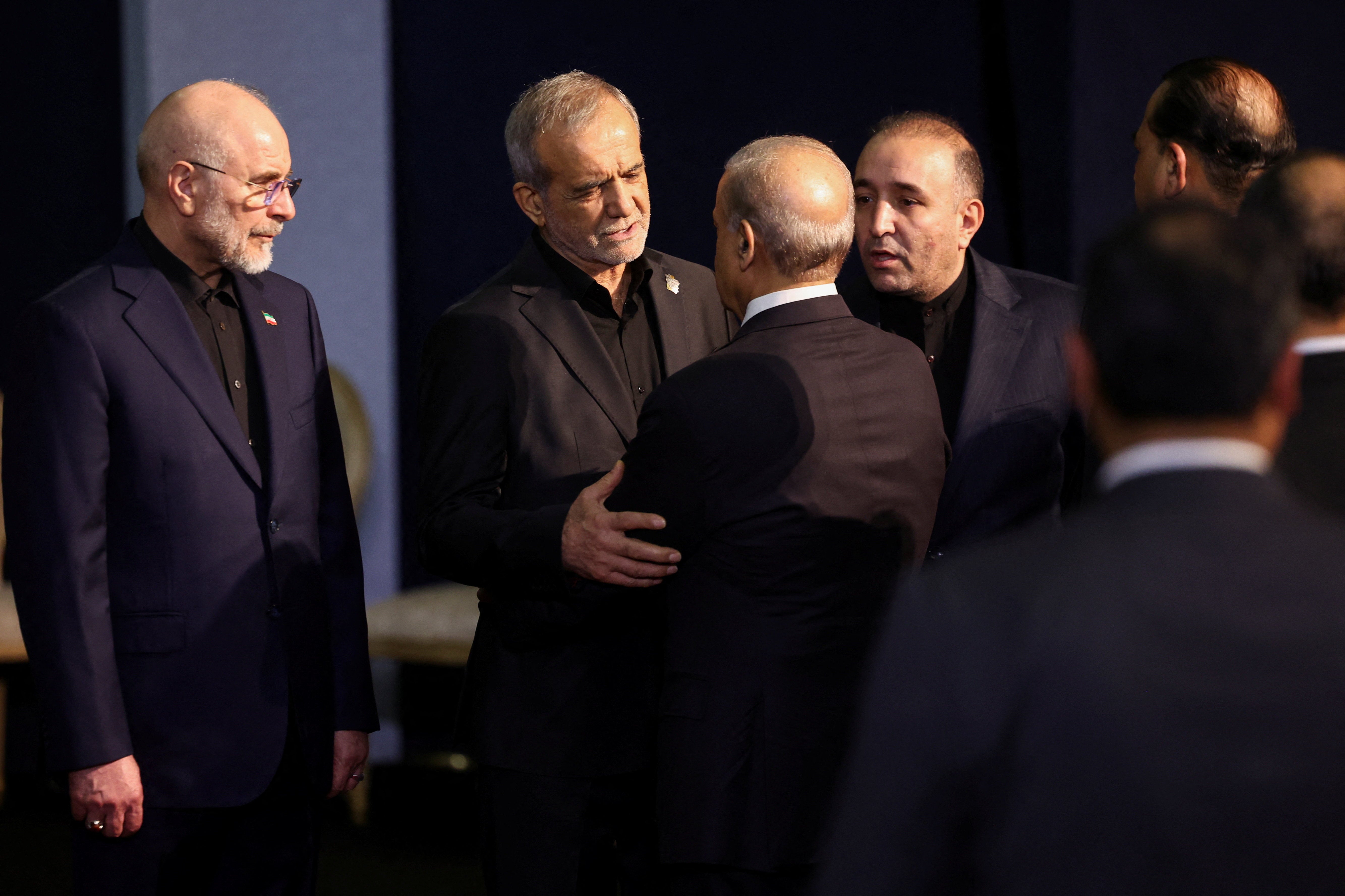 Iranian President Masoud Pezeshkian interacts with Pakistani Prime Minister Shehbaz Sharif next to Iranian Parliament Speaker Mohammad Bagher Ghalibaf as they attend a farewell ceremony for Iran's late Supreme Leader Ayatollah Ali Khamenei, for international delegates at the Imam Khomeini Grand Mosalla in Tehran, Iran July 3, 2026. (Reuters)