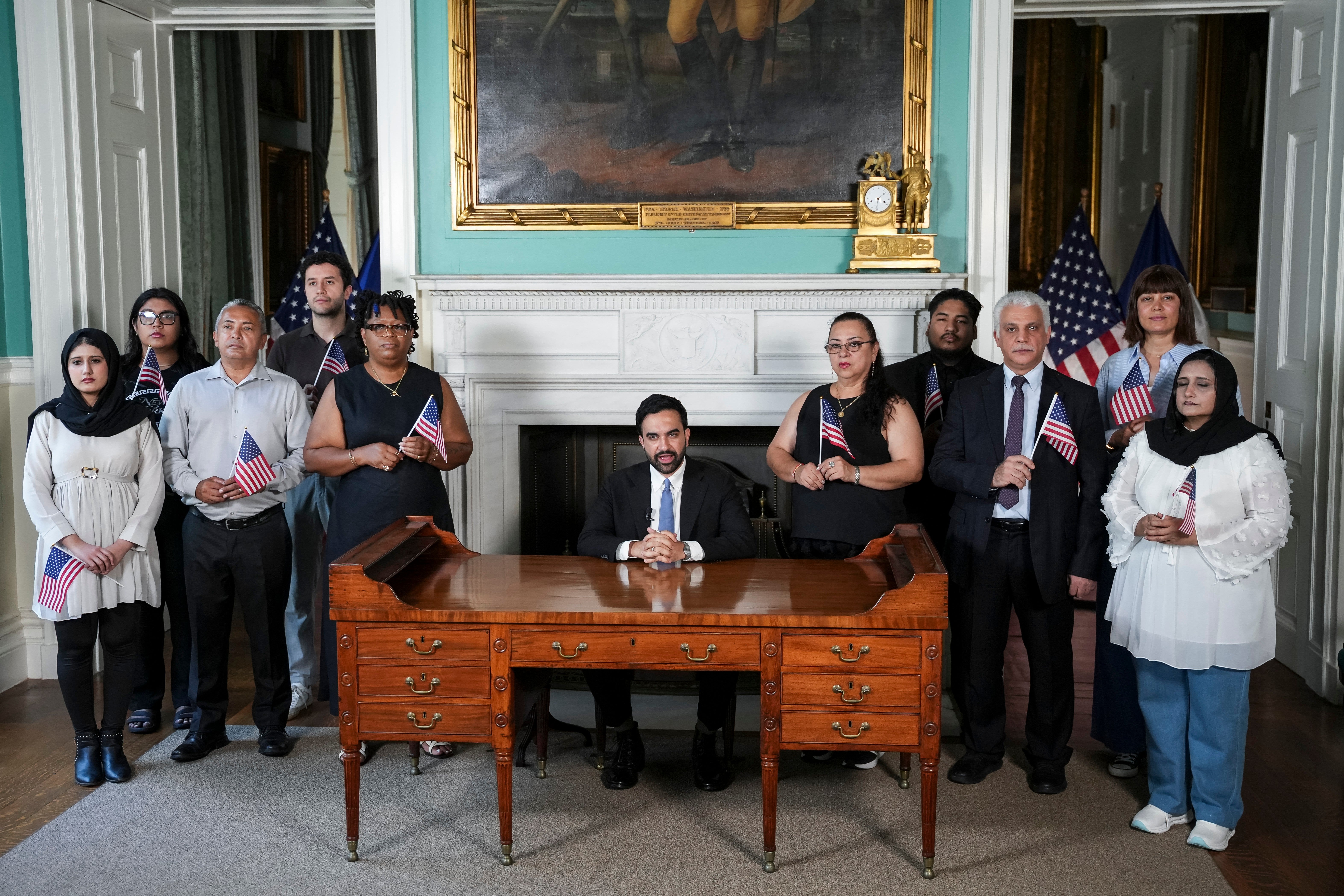 The mayor, surrounded by a group of new US citizens, said the ideals enshrined in the nation’s founding principles are ‘strong enough to endure any authoritarian regime’