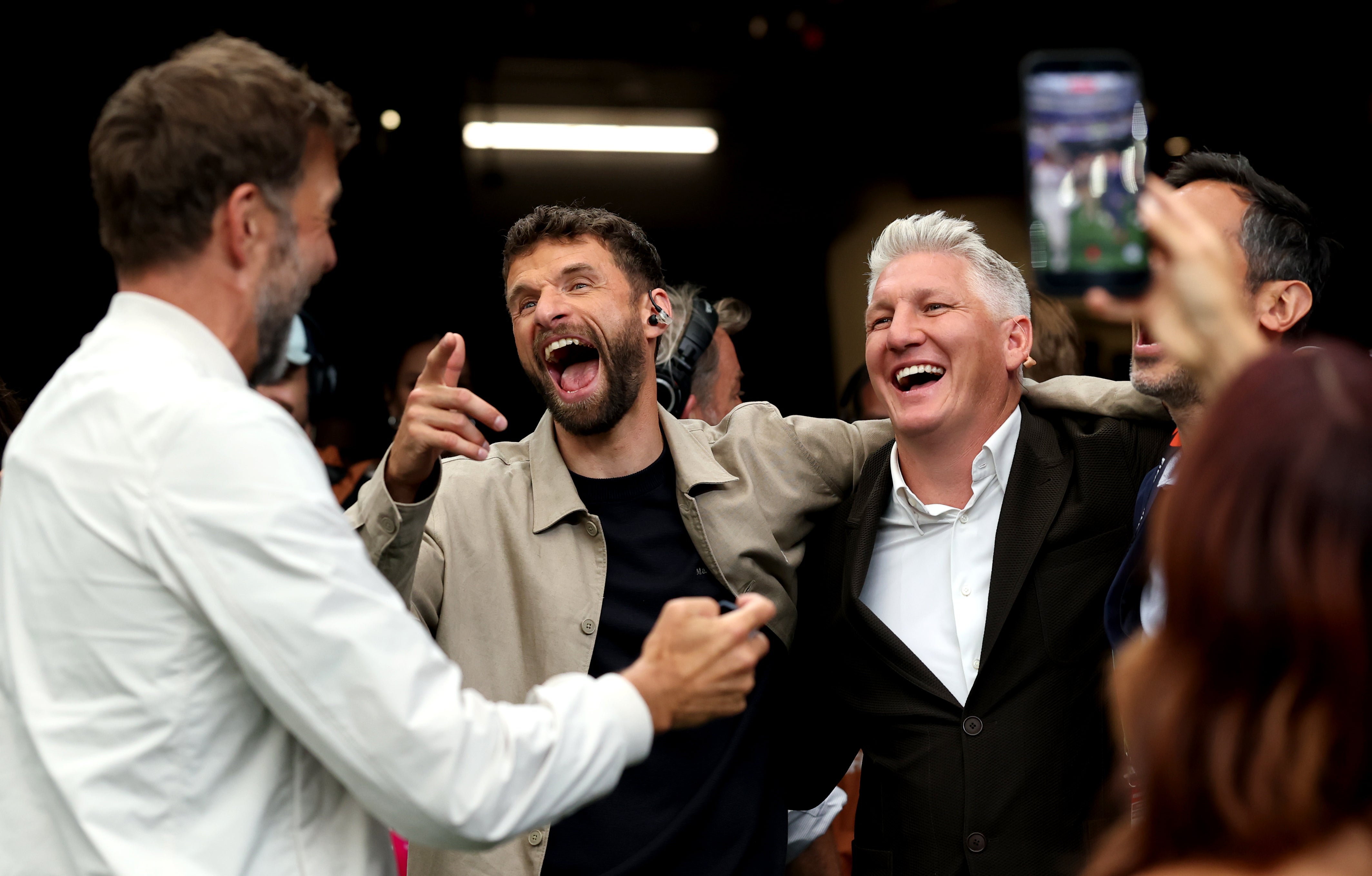 Jurgen Klopp, Thomas Muller and Bastian Schweinsteiger interact at Germany v Curacao