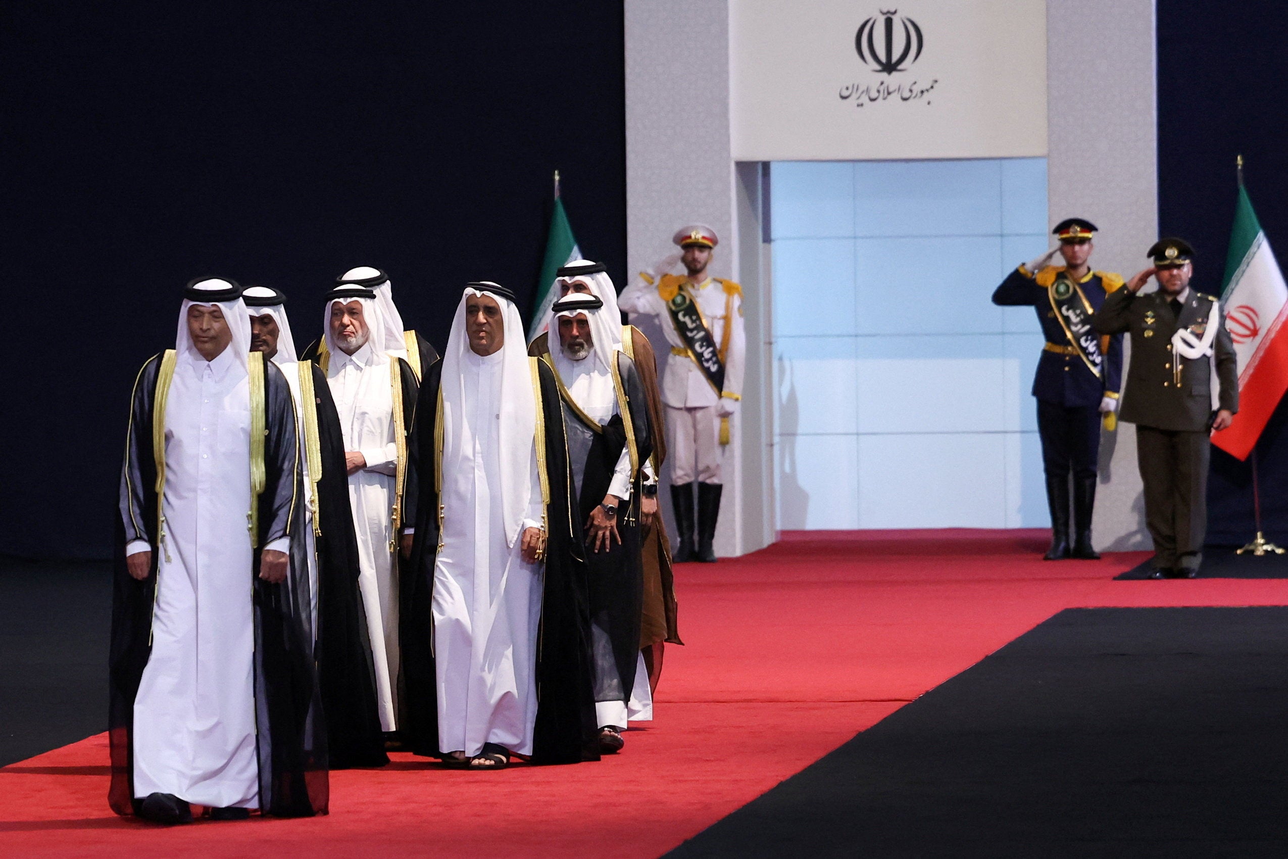 Qatar's Speaker of the Shura Council Hassan bin Abdullah Al Ghanim, accompanied by members of a Qatari delegation (Reuters)
