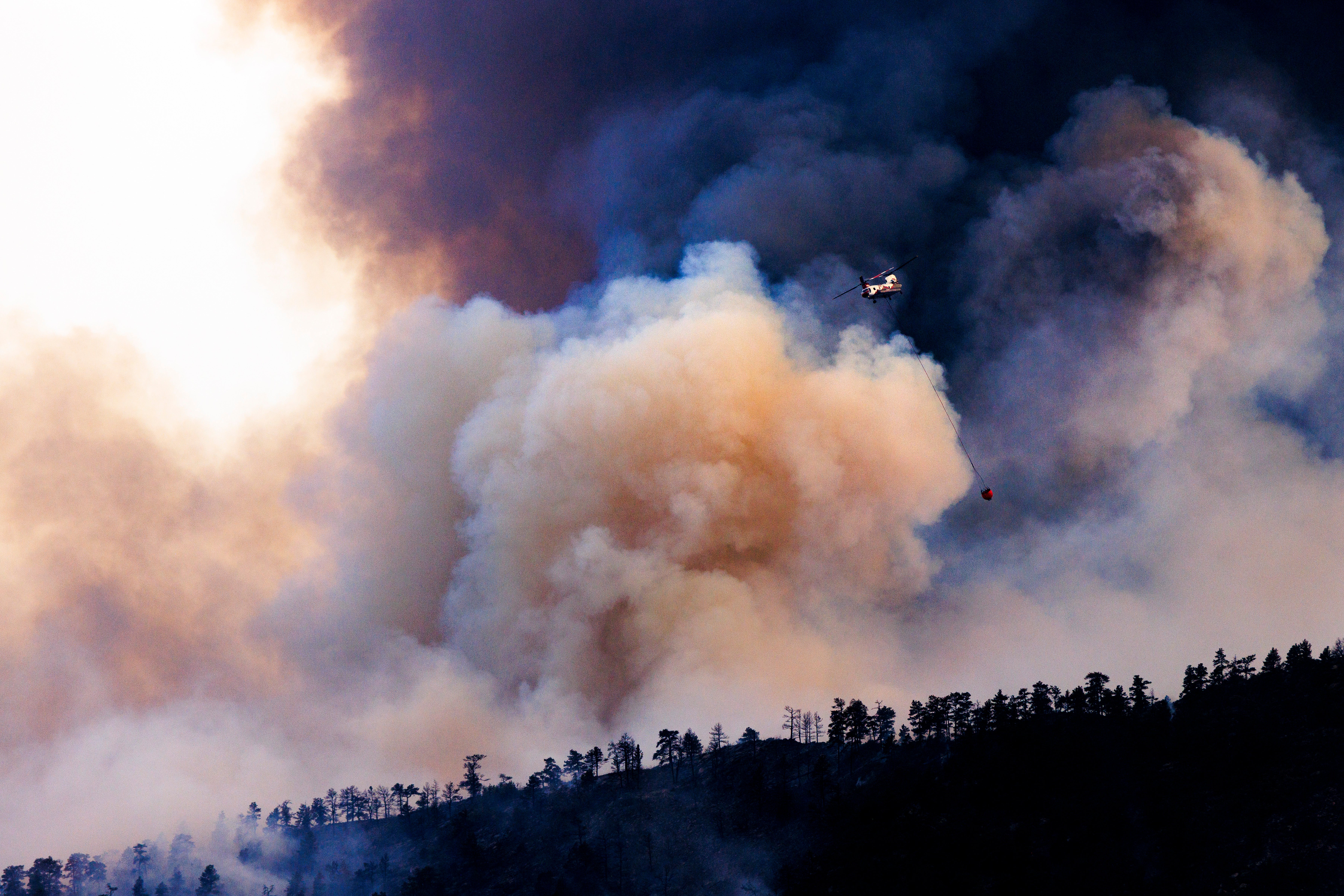 Erratic winds pushed the blaze across two Colorado counties