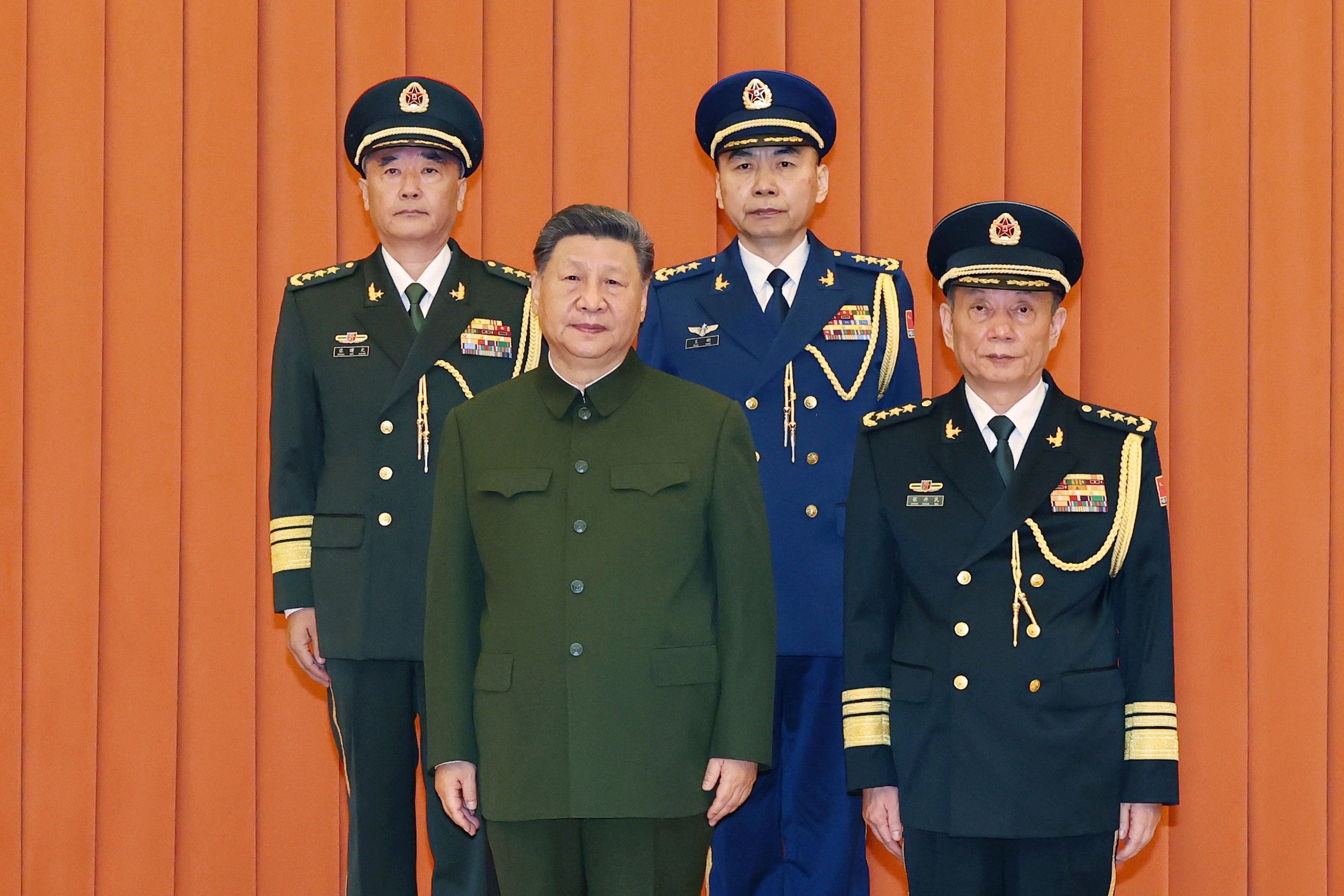 Central Military Commission chairman Xi Jinping and vice chairman Zhang Shengmin pose with newly promoted generals Zhang Shuguang, top left, and Wang Gang, top right, in Beijing on 3 July 2026