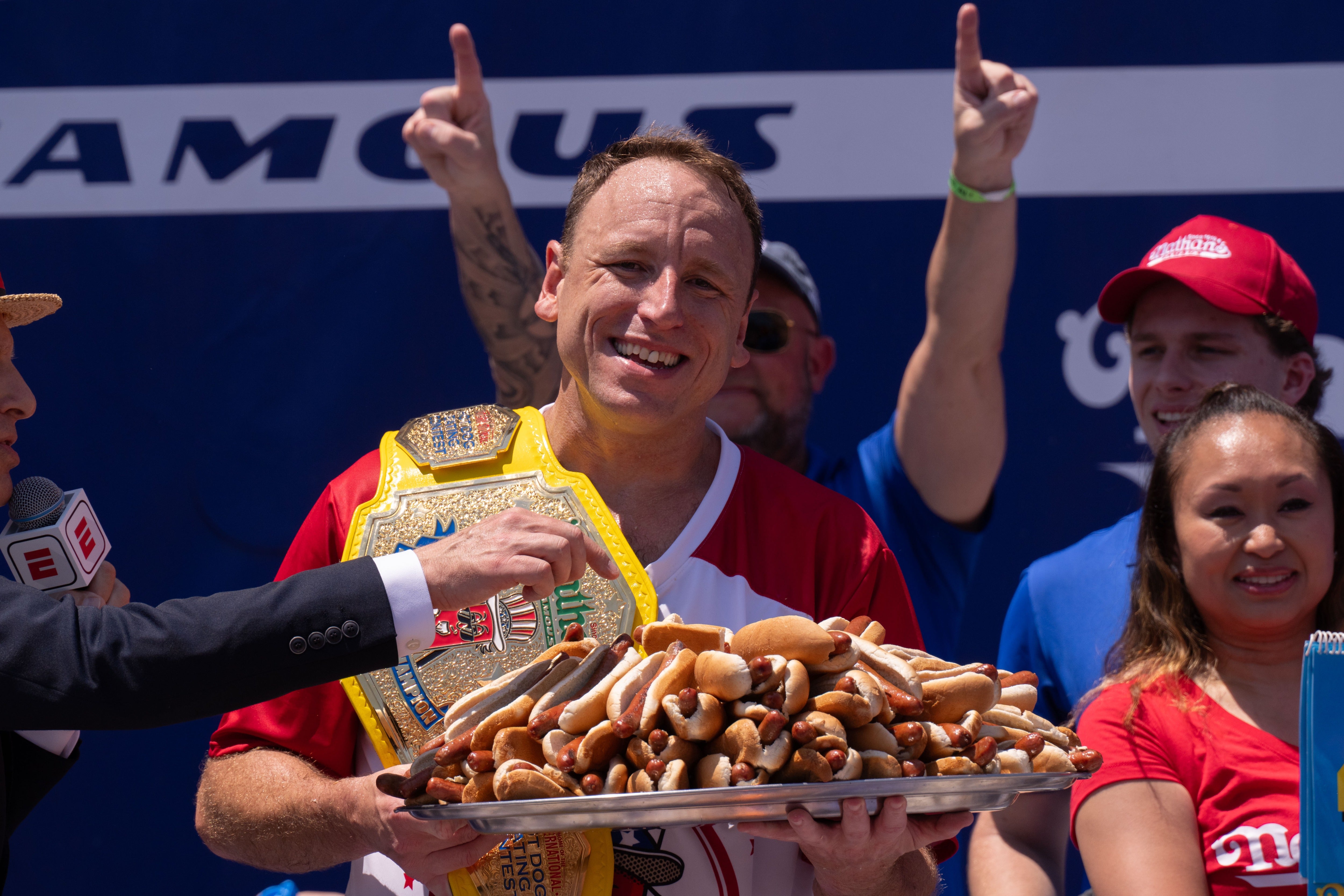 Joey Chestnut celebrates after winning the men's competition in 2025