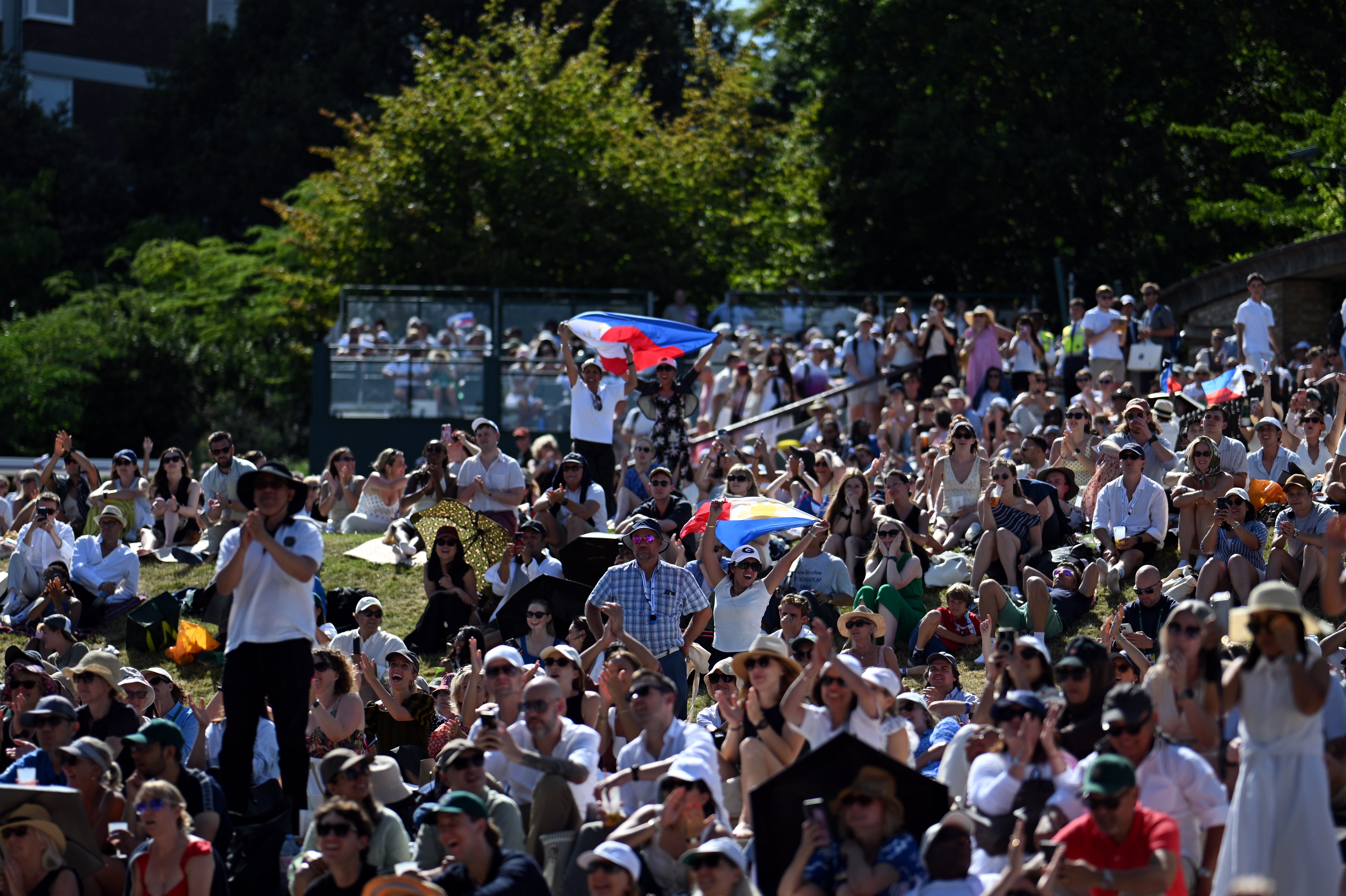 Many of Eala's fans watched her match from Henman Hill at Wimbledon and waved the Philippines flag (Getty)