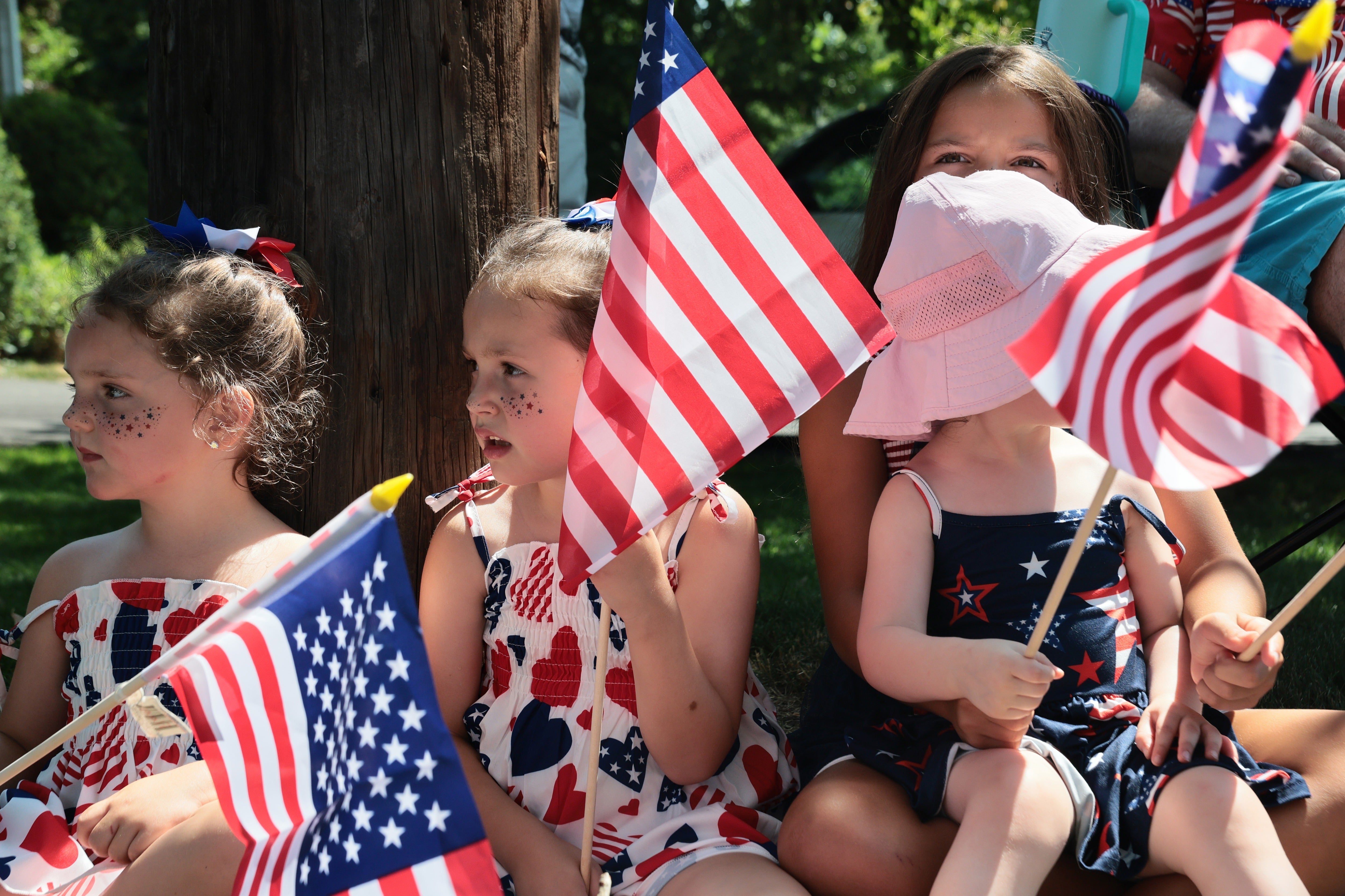 Children watch a July Fourth Parade along the Walkway of Heroes and Independence Avenue on July 04, 2026 in Tappan, New York