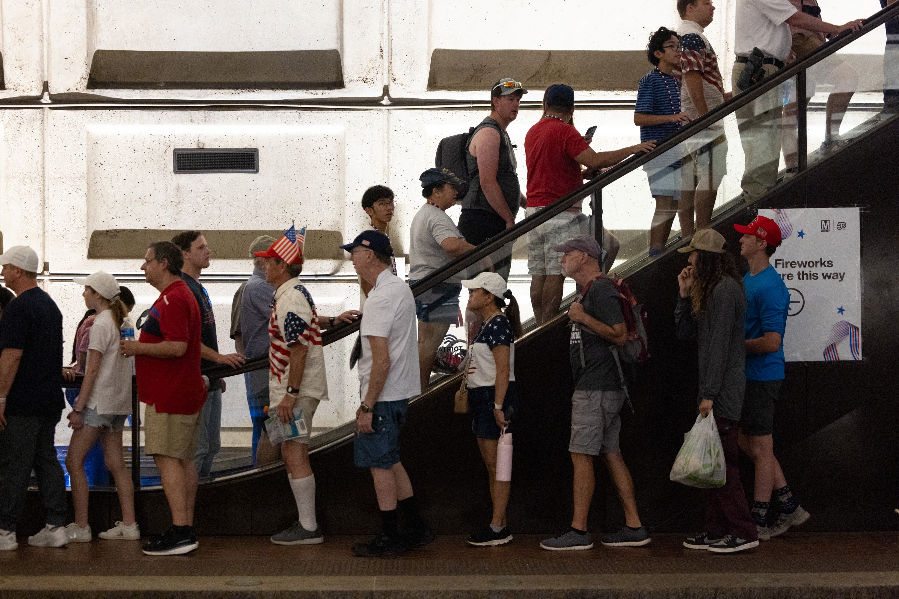 People line up at Washington, D.C.'s Smithsonian metro station, located near the National Mall