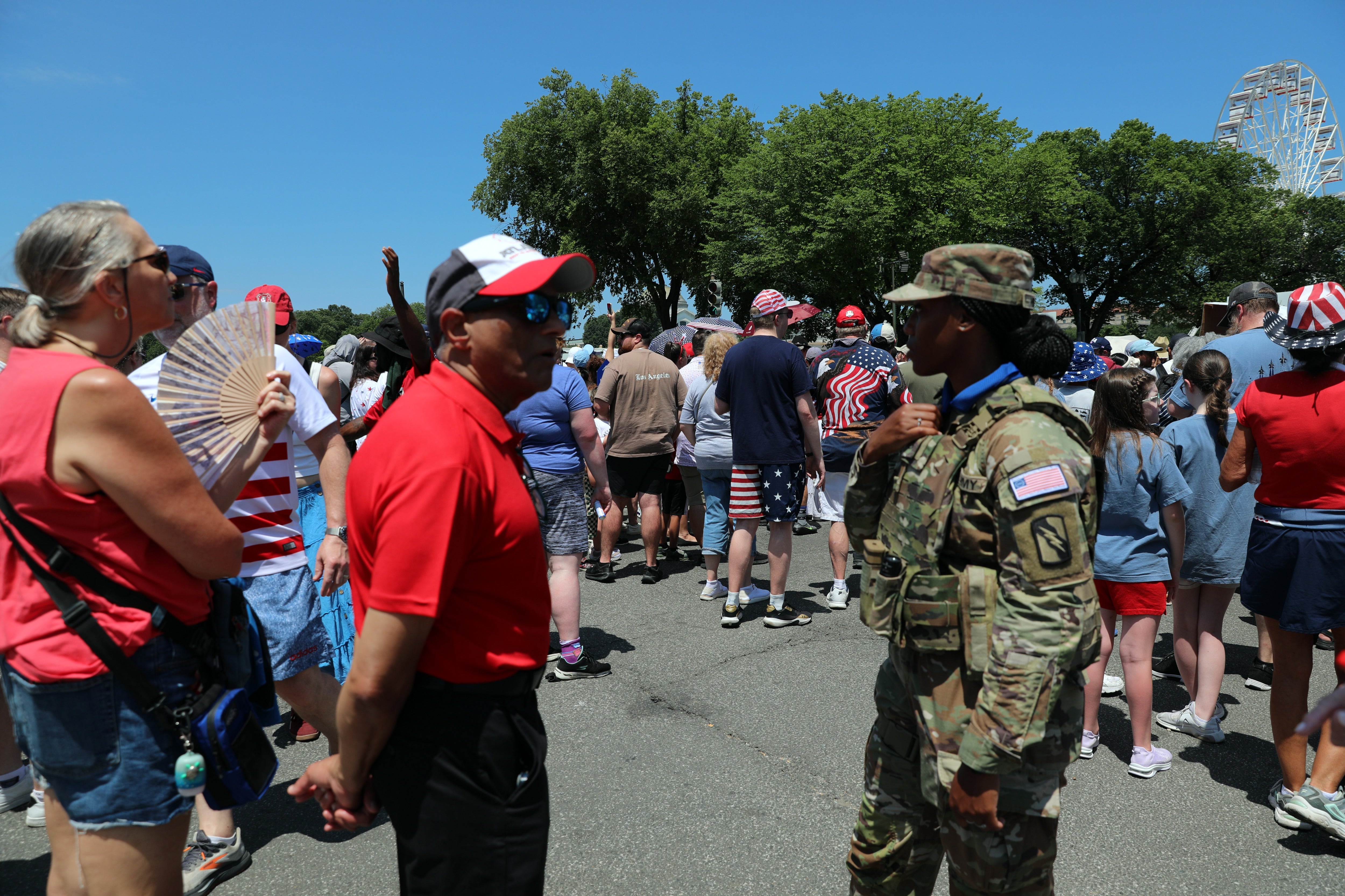 People wait to enter the National Mall ahead of tonight's Fourth of July celebrations