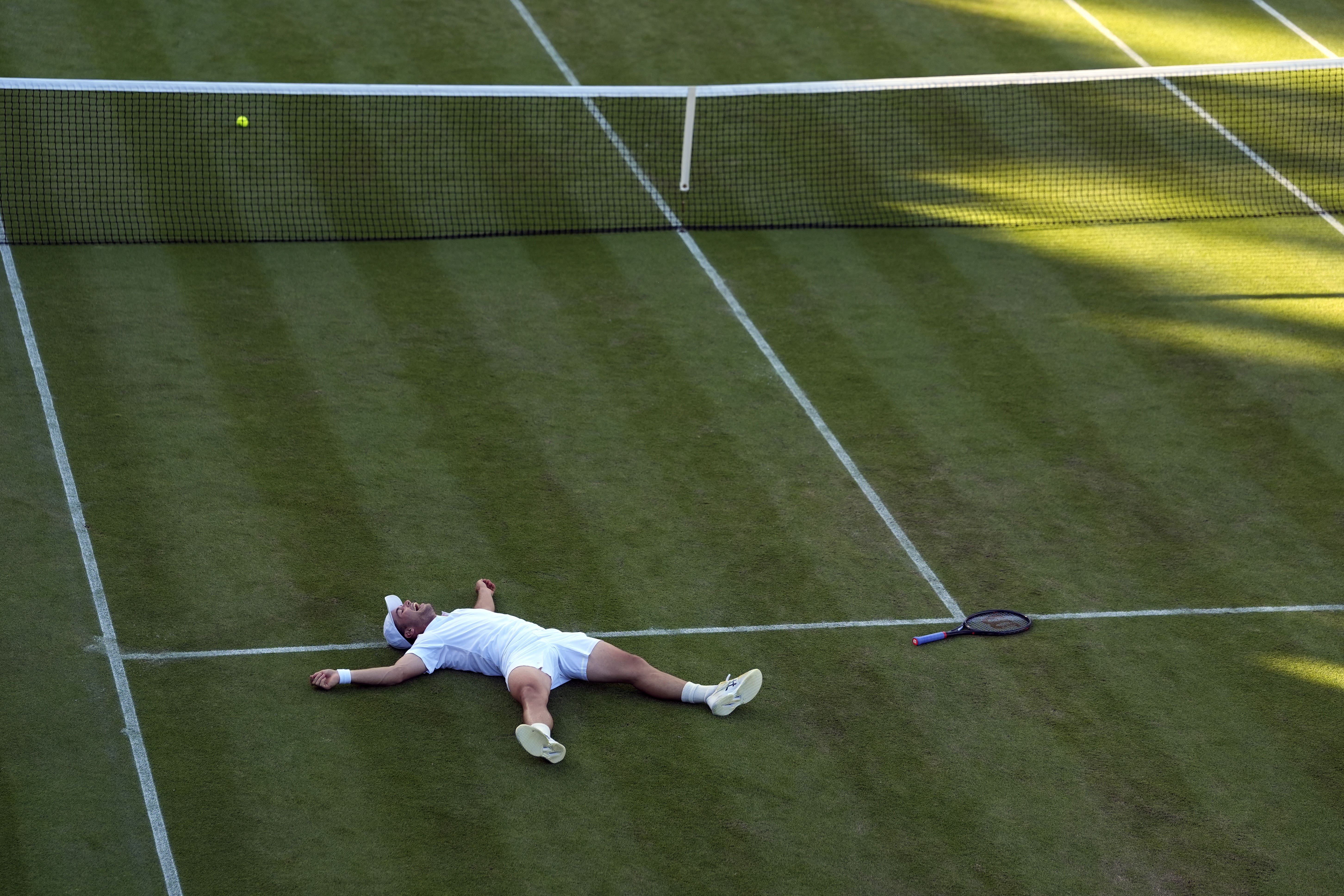 Arthur Fery lies on Court 18 after beating Zizou Bergs (Andrew Matthews/PA) (PA Wire)