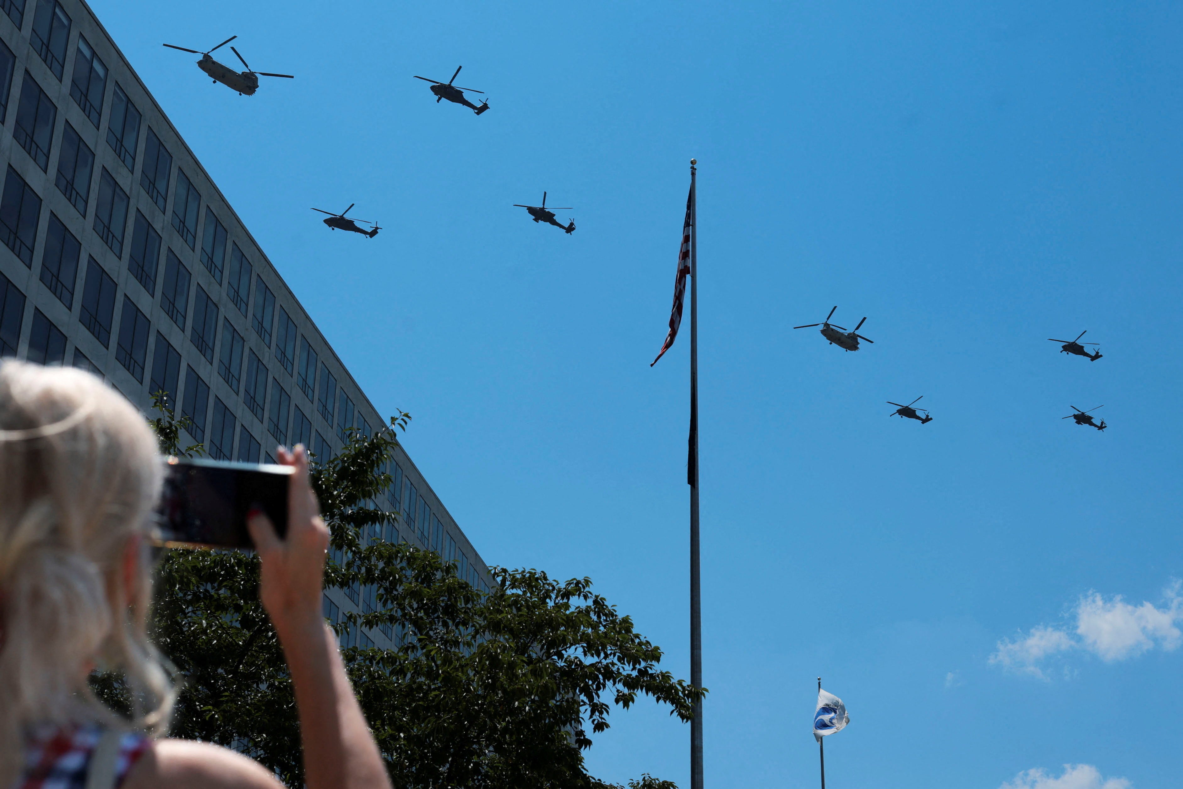 U.S. military helicopters flew over the National Mall on Saturday afternoon