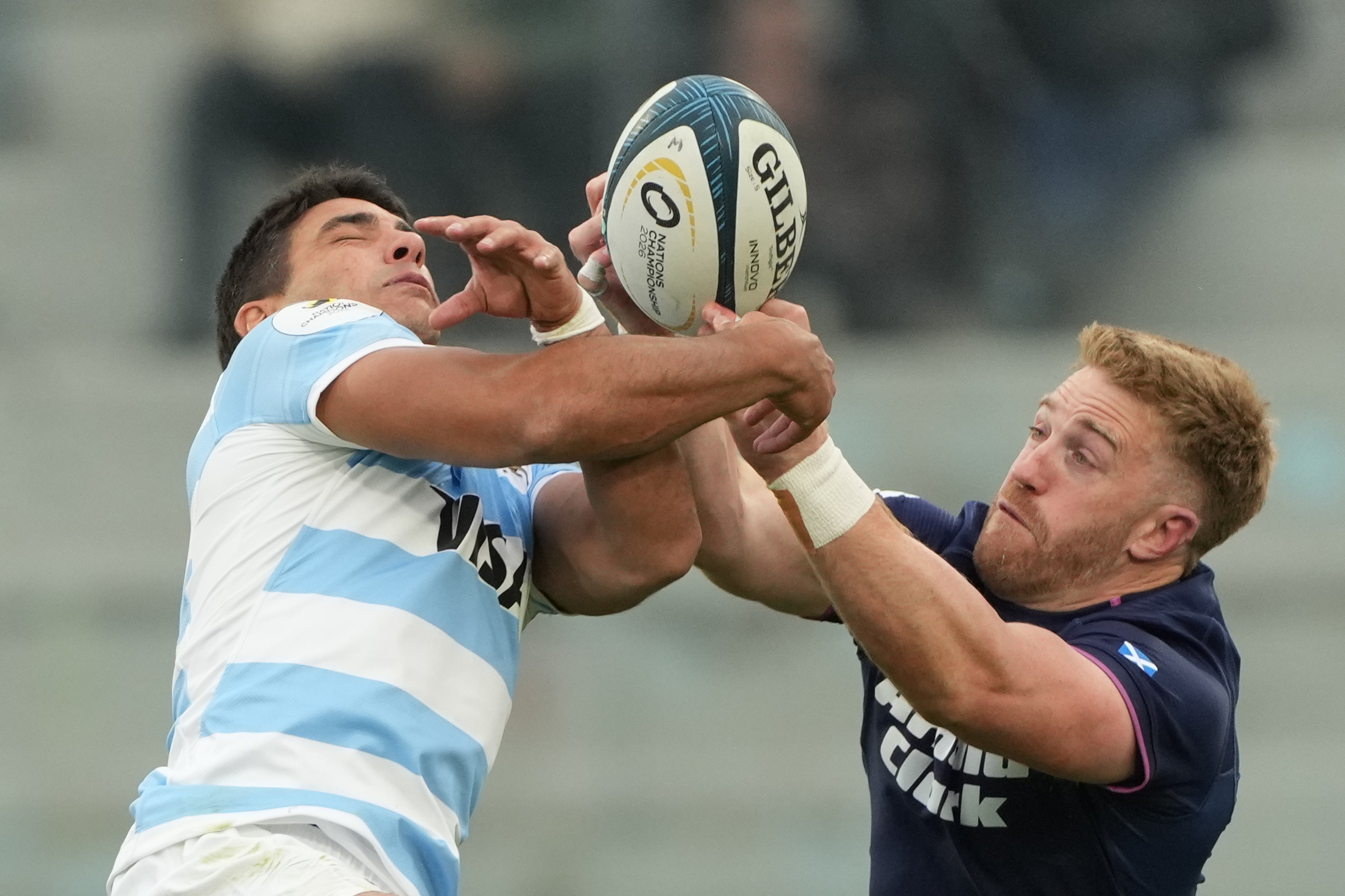 Kyle Steyn, right, and Lucio Cinti jump for the ball (Gustavo Garello/AP) (AP)