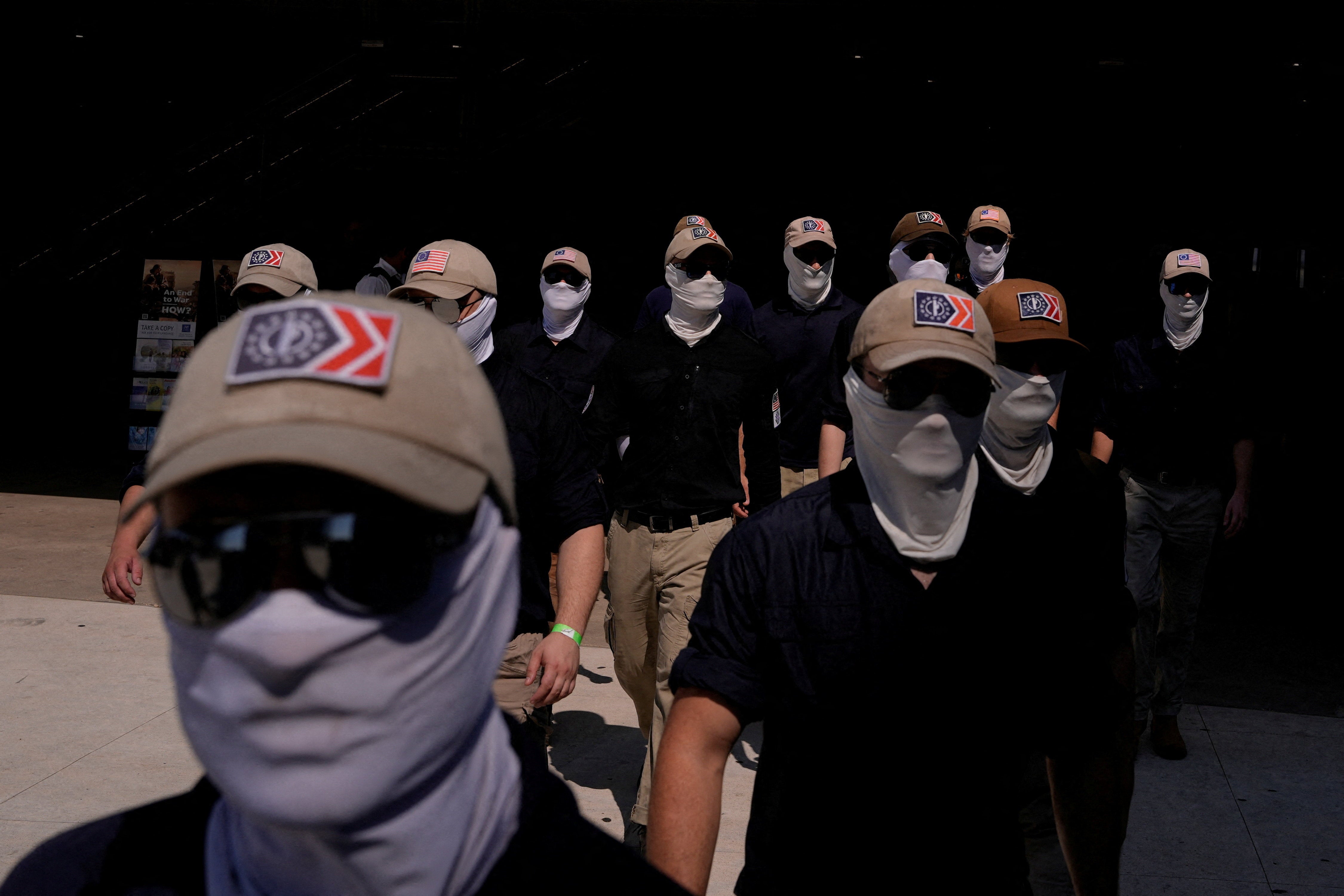 Members of the group, which espouses anti-immigrant views and believes multiracial democracies are an existential threat to white people, typically wear masks and sunglasses to cover their faces