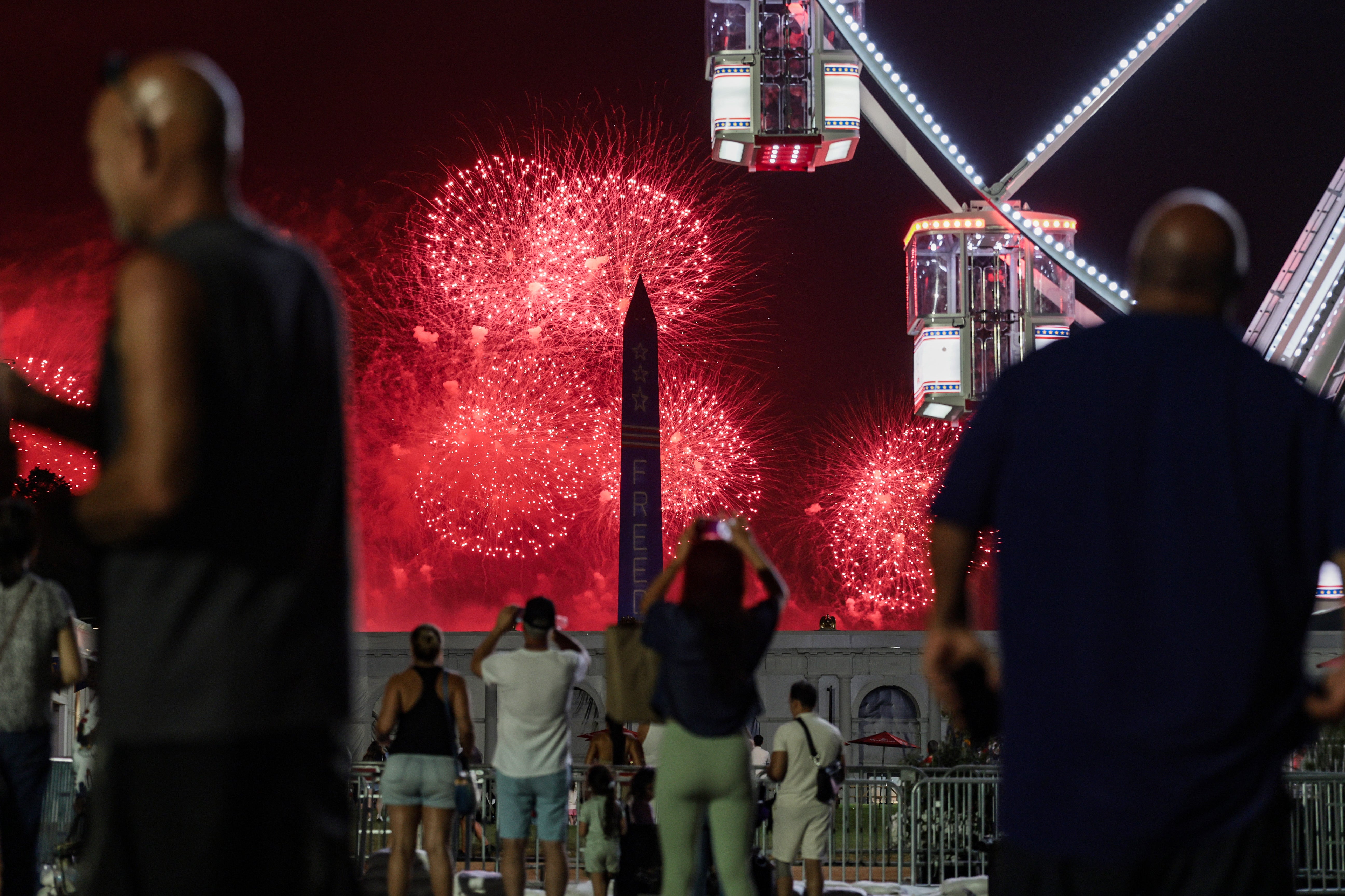 After the evacuation orders were lifted, large crowds returned to the National Mall to hear Trump’s speech and watch the fireworks display (Getty)
