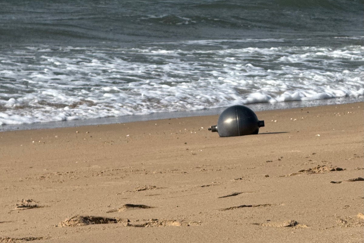 Strange balls found on Queensland beaches could be toxic ‘space debris’, experts warn