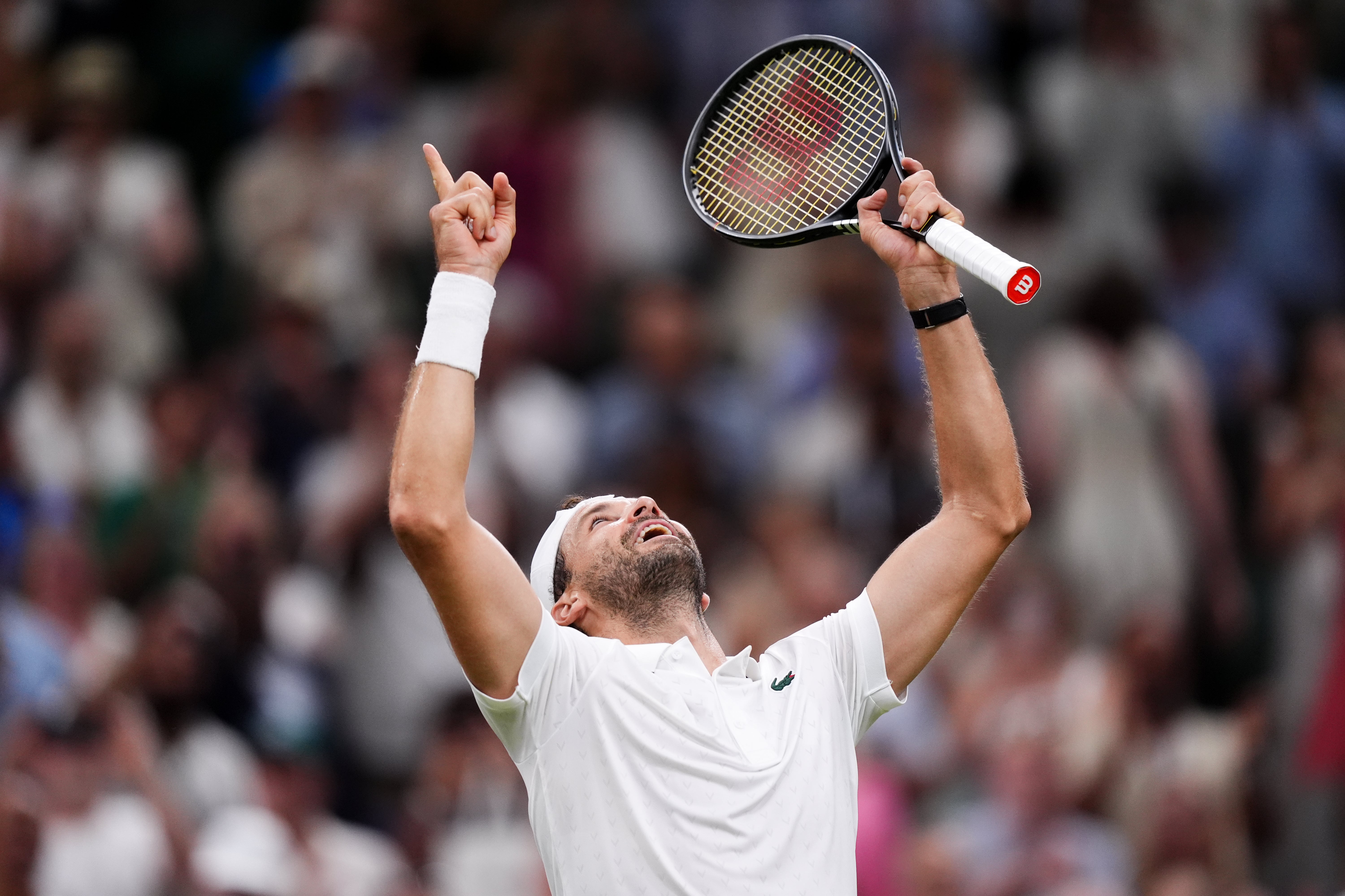 Grigor Dimitrov points to the roof after beating Matteo Berrettini (Mike Egerton/PA)