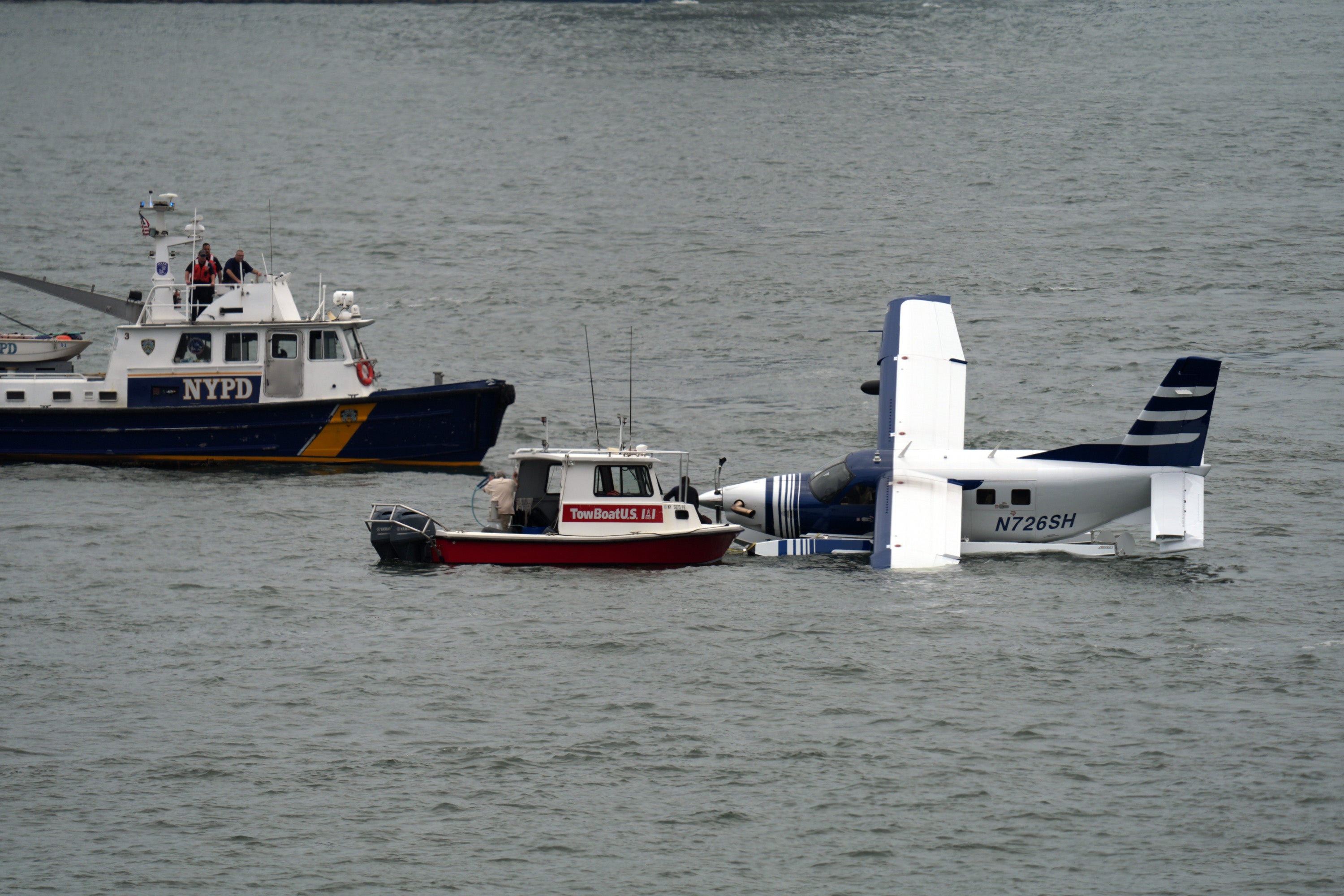 Crews are towing the seaplane back to the dock, fire officials said