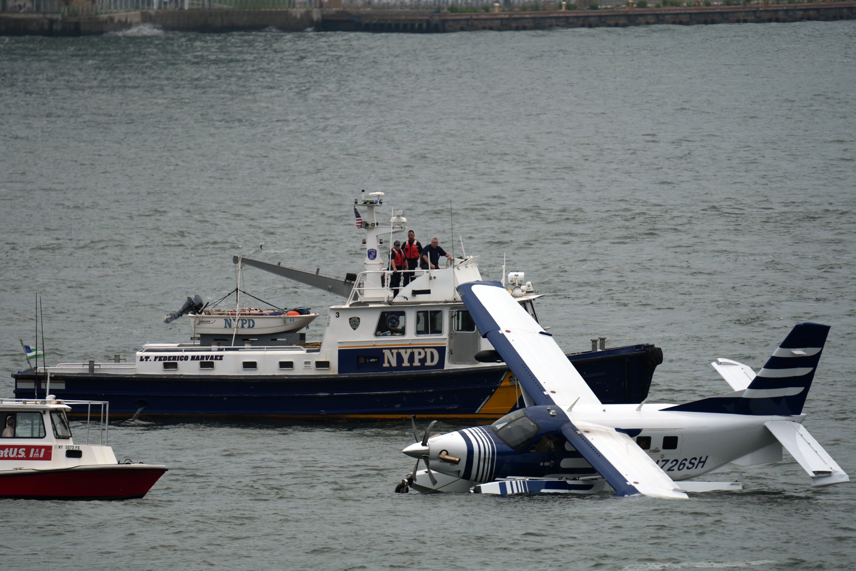 Crews rescued eight adults from the seaplane, including the pilot, police said