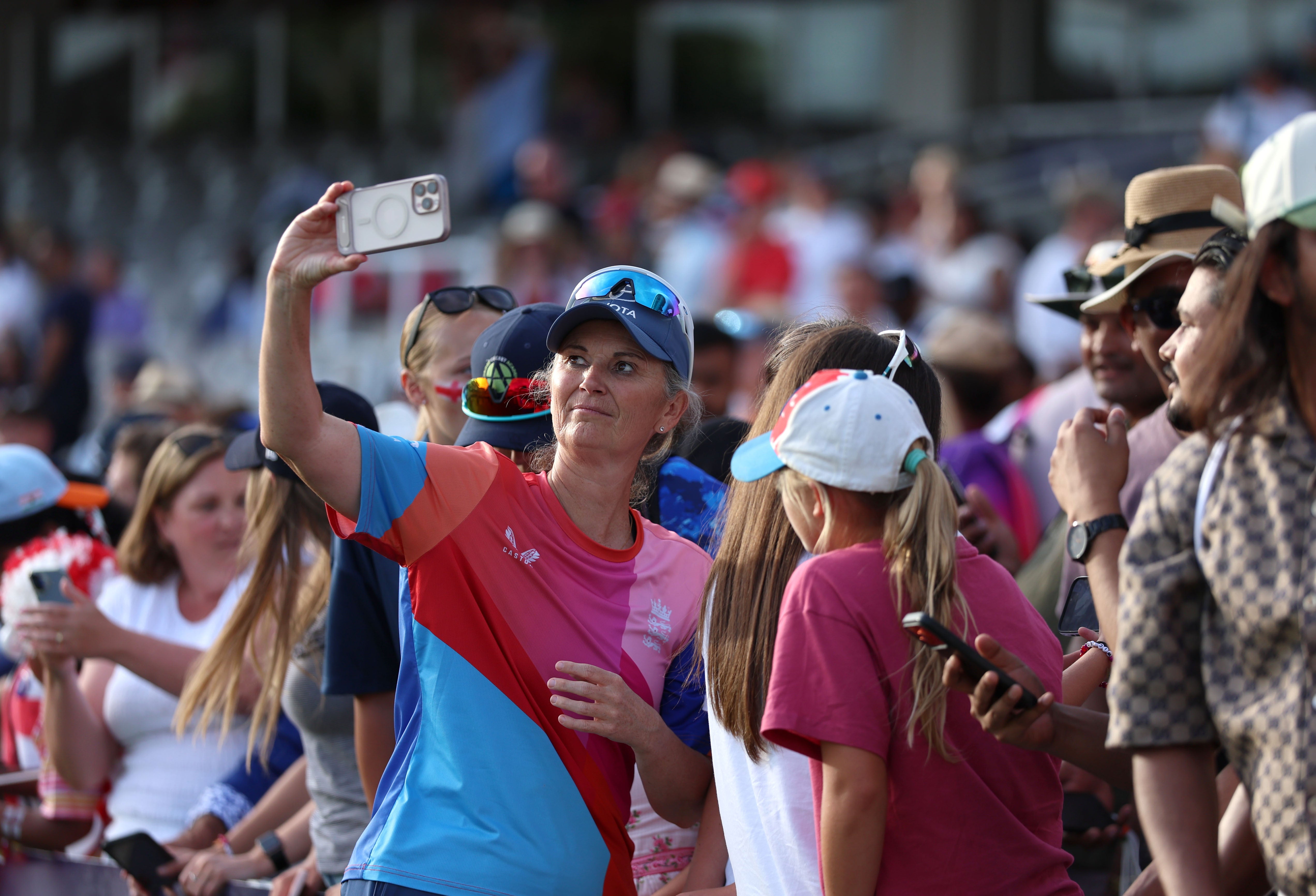 Charlotte Edwards poses for a photo with fans (Steven Paston/PA)