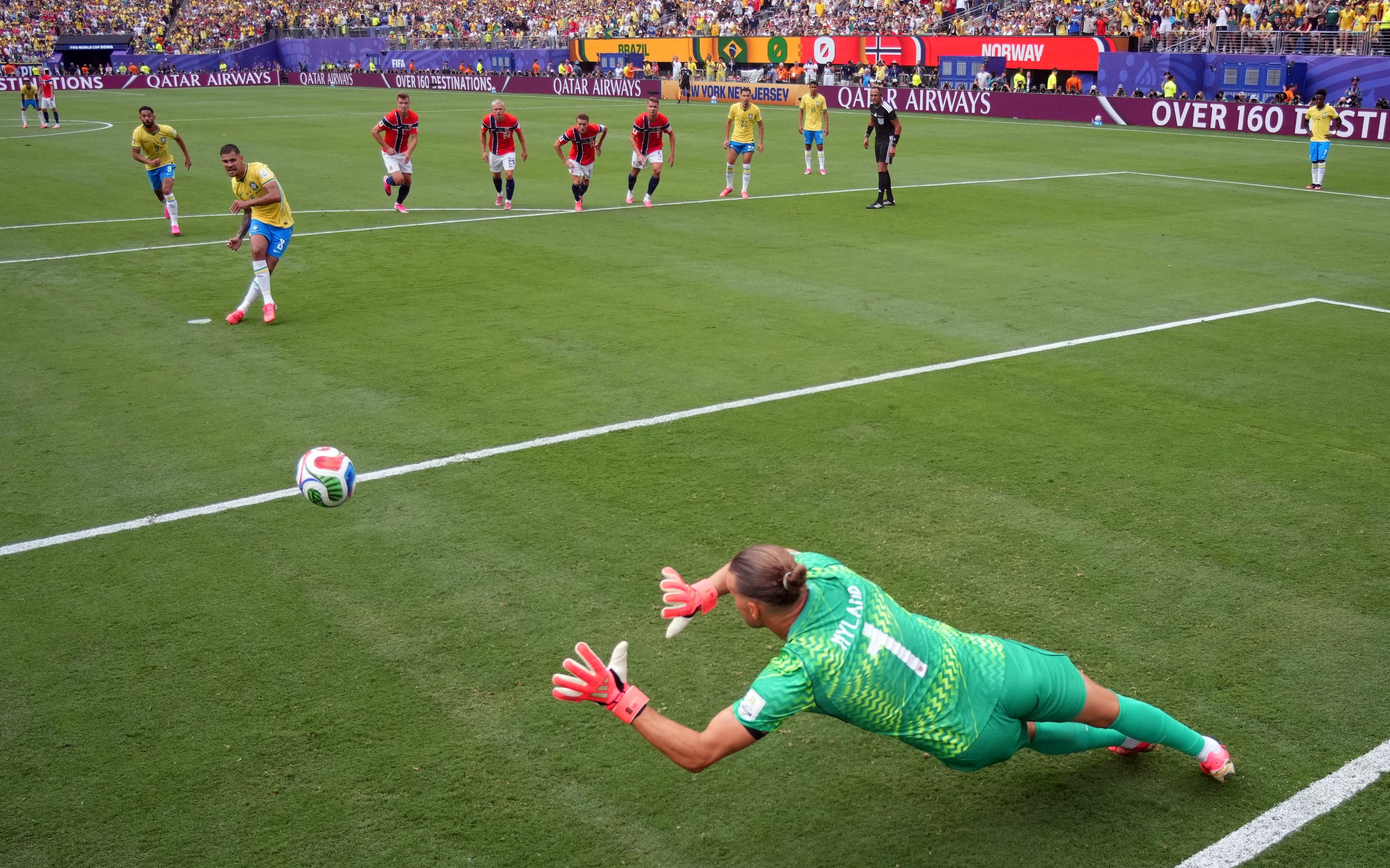 Norway's Orjan Nyland saves a penalty by Brazil's Bruno Guimaraes