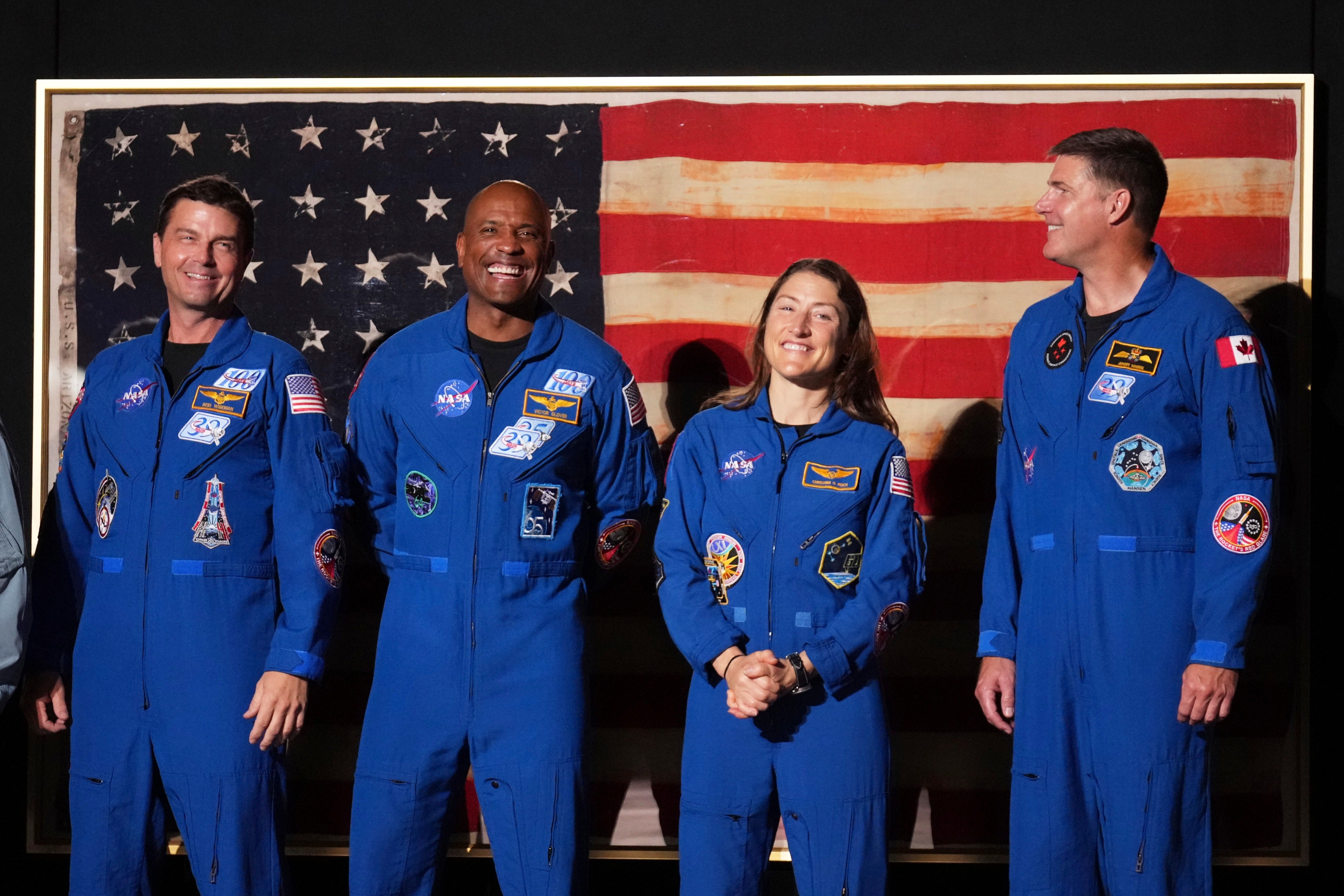NASA's Artemis II crew greets the crowd during President Donald Trump's speech on the National Mall (AP Photo/Mark Schiefelbein)