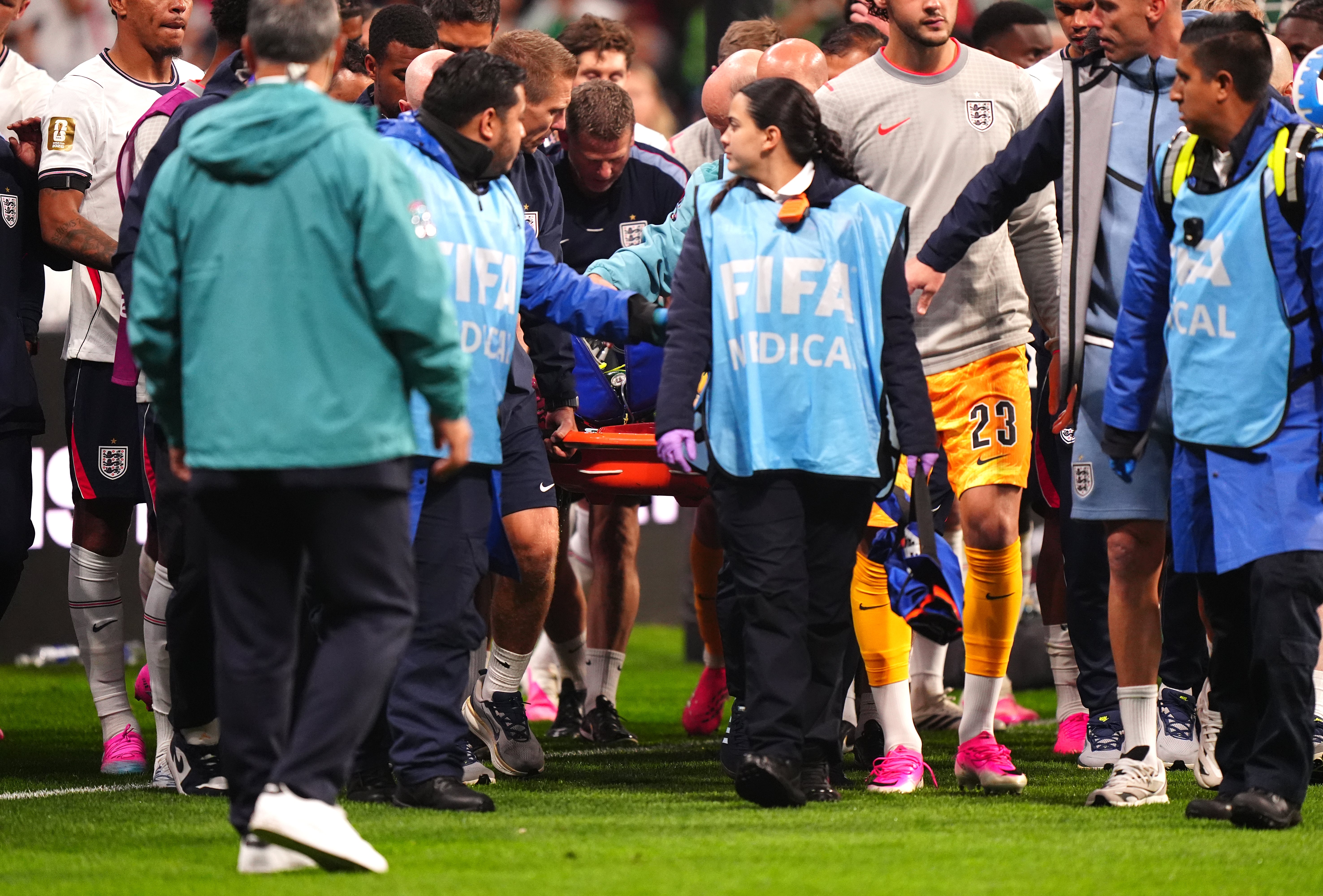 Henderson being carried away on a stretcher at the Azteca (PA)