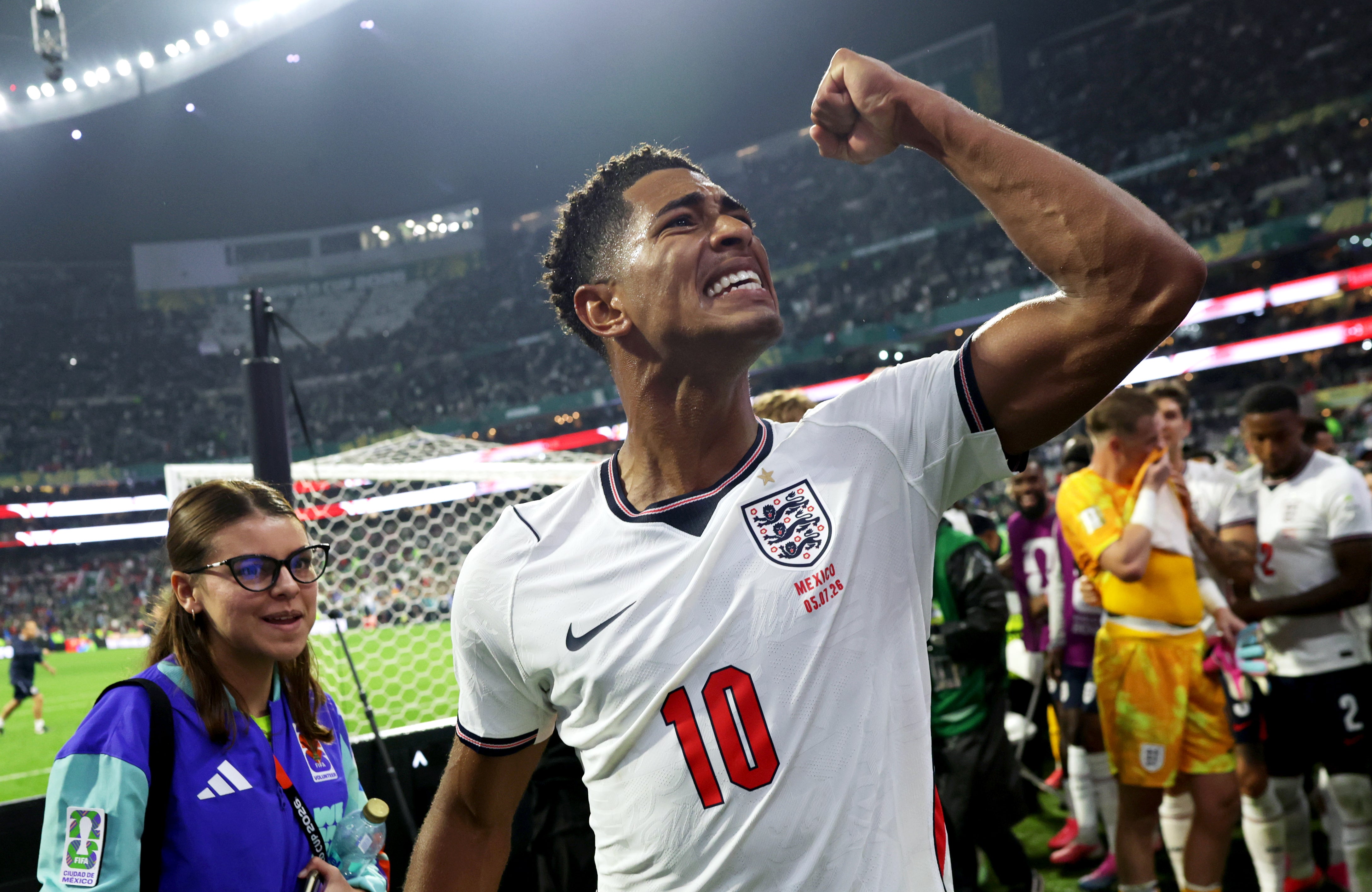 Jude Bellingham celebrates with England fans at the Azteca Stadium