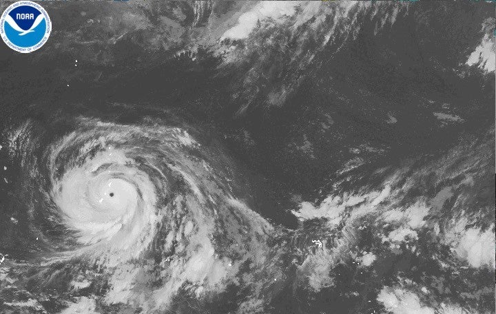 This satellite image released by NOAA shows Typhoon Bavi developing in the western Pacific region near Guam