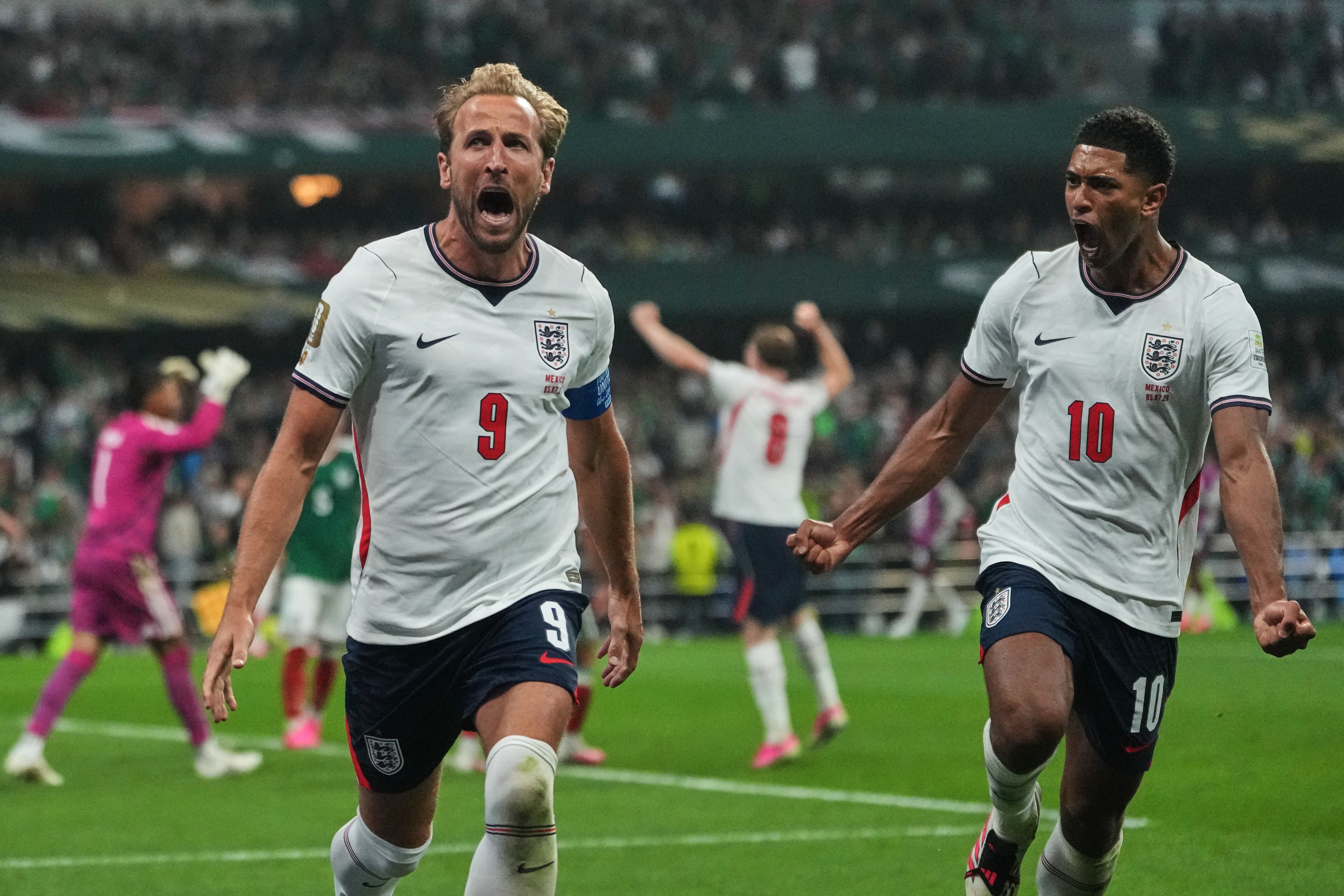 Harry Kane celebrates with Jude Bellingham