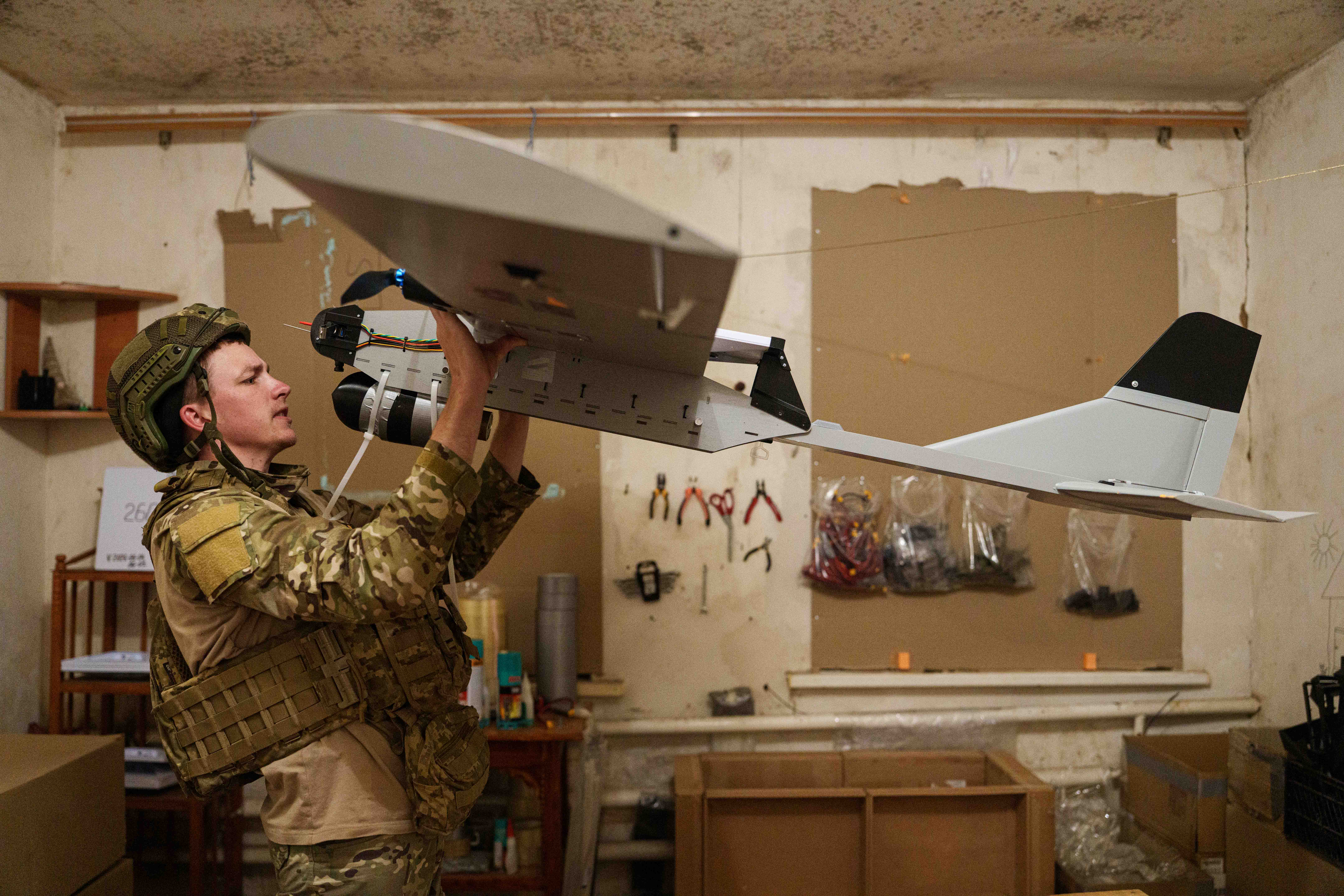 A serviceman with Ukraine’s K-2 brigade prepares a midrange drone before flying it toward Russian positions on the front line in Ukraine’s Donetsk region on June 22, 2026. (AP Photo/Evgeniy Maloletka)