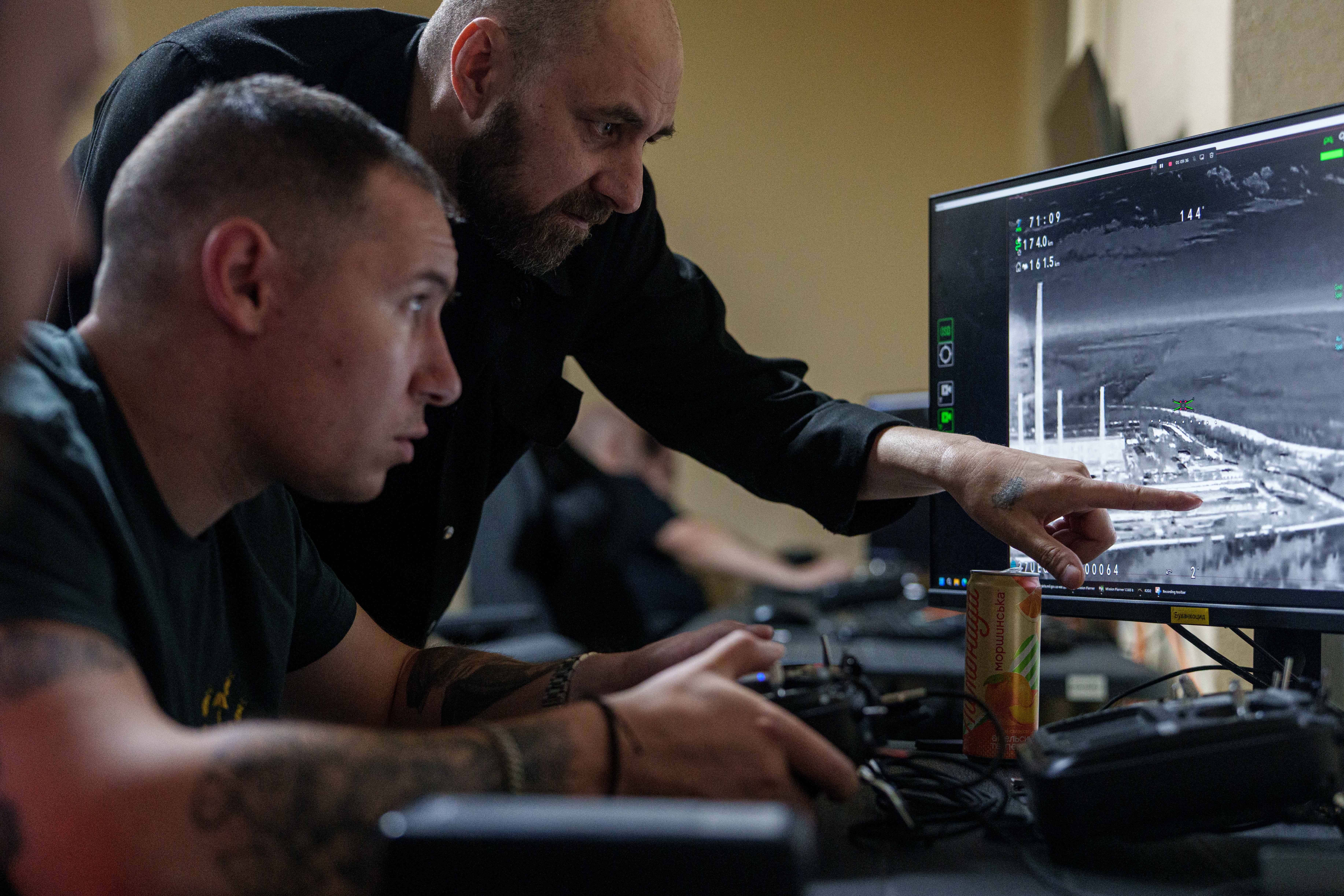 A Ukrainian serviceman of K-2 brigade of the Unmanned Systems Forces operates a midrange drone during a flight towards Russian positions at the frontline, at a command center in undisclosed location, Ukraine, Sunday, June 21, 2026. (AP Photo/Evgeniy Maloletka)