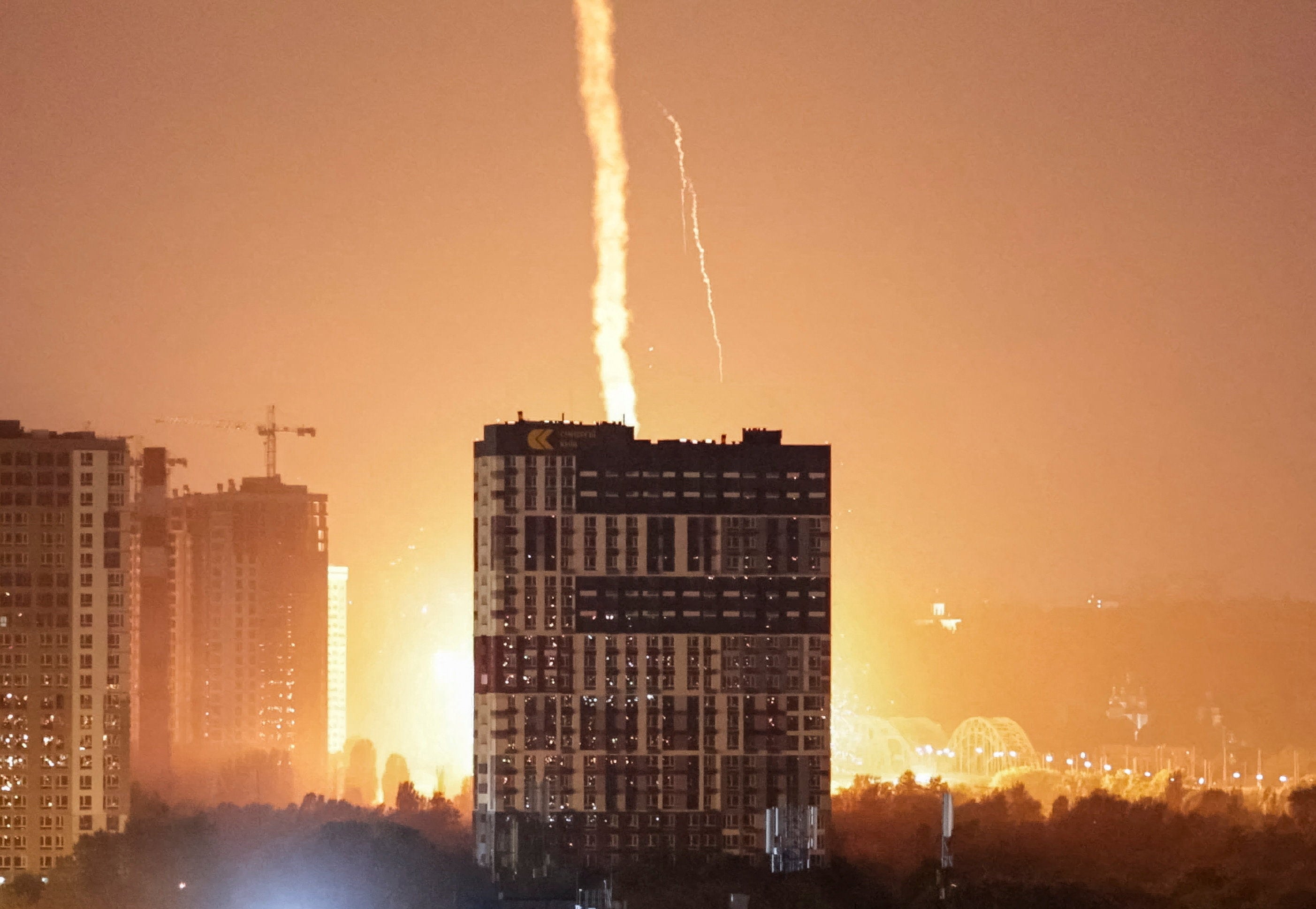An explosion lights up the sky over the city during a Russian missile and drone strike, amid Russia's attack on Ukraine, in Kyiv, Ukraine July 6 (Reuters)