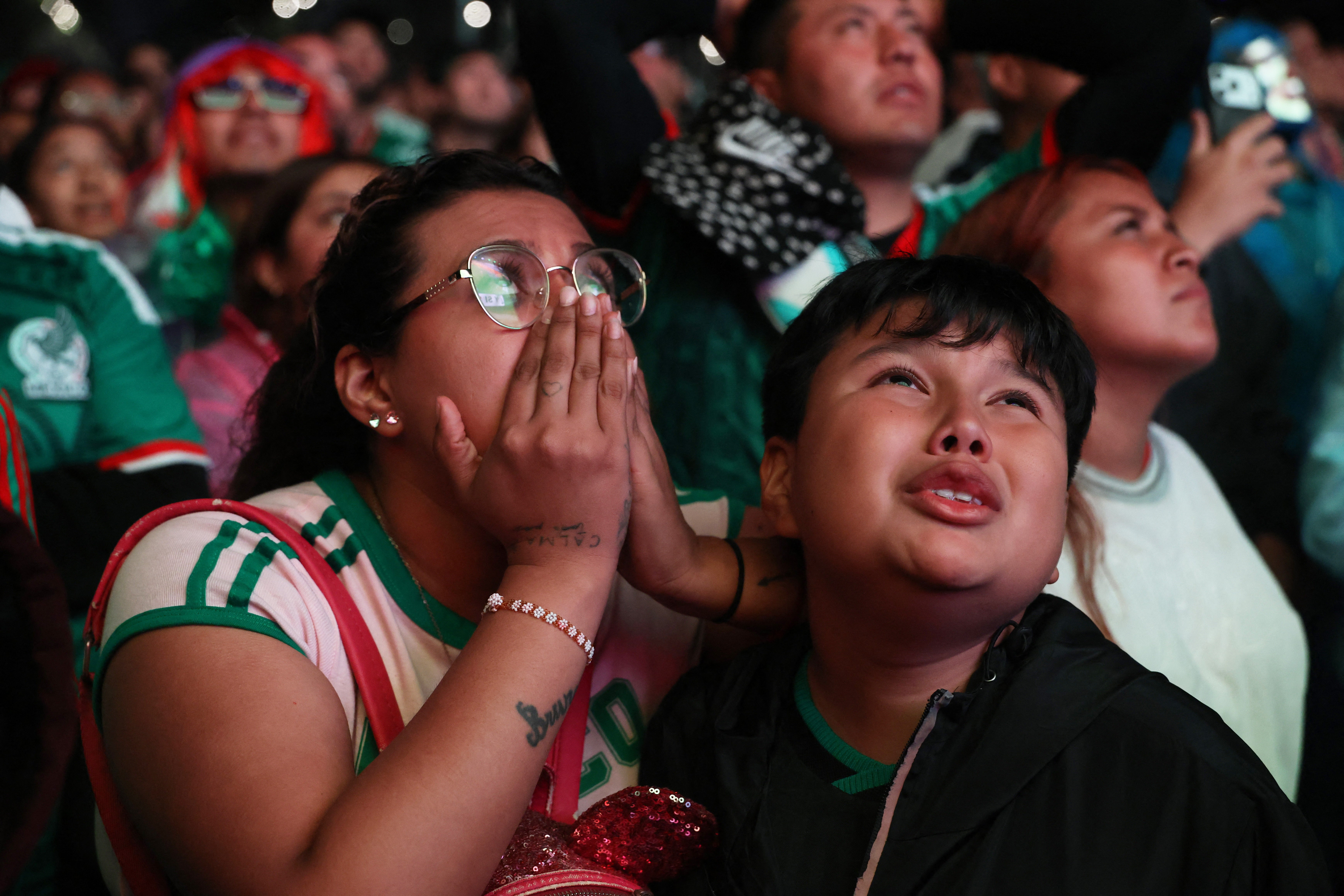 Dejected Mexico fans in their capital city during the game with England