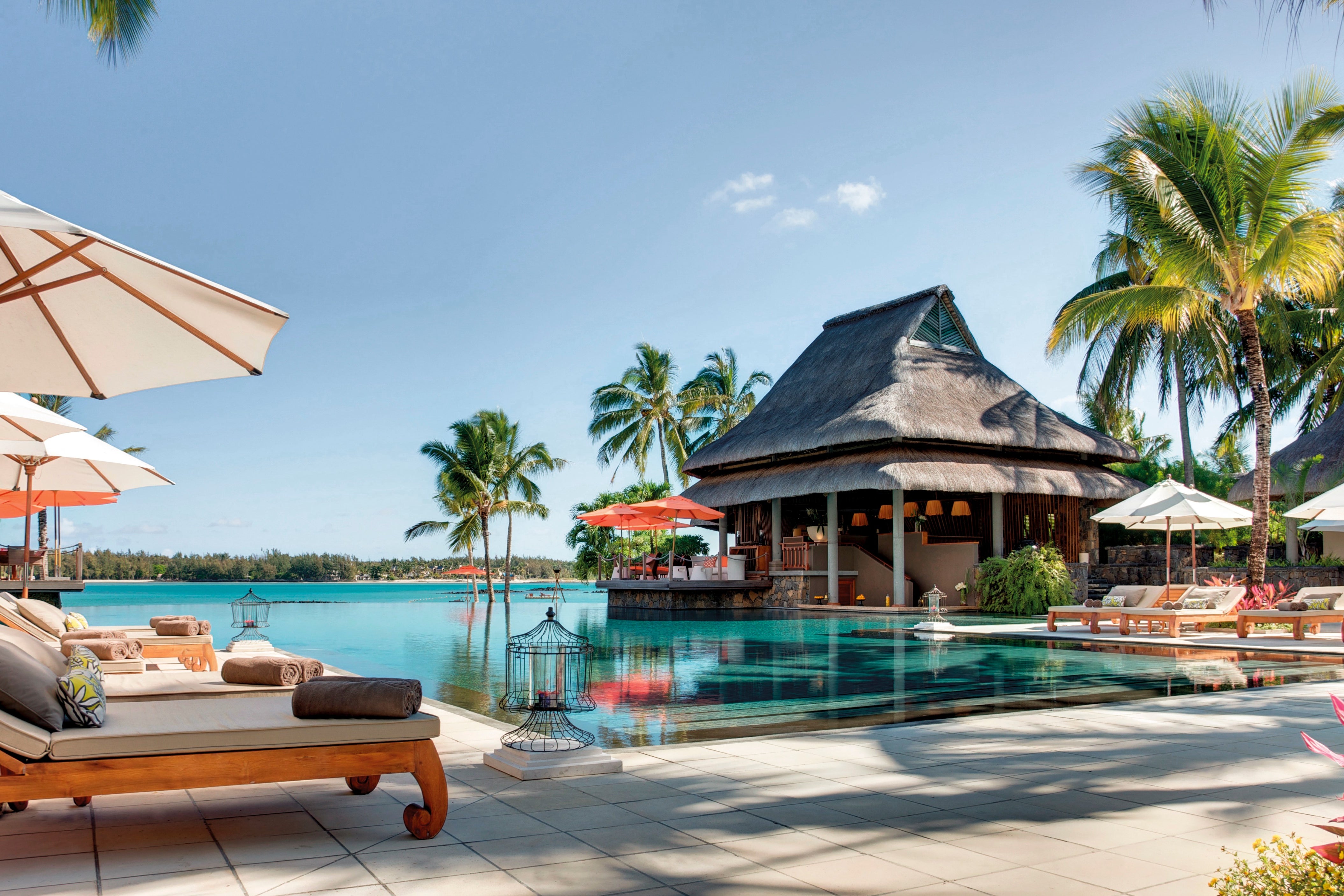The infinity pool appears to spill over onto the beach (Constance Hotels & Resorts)