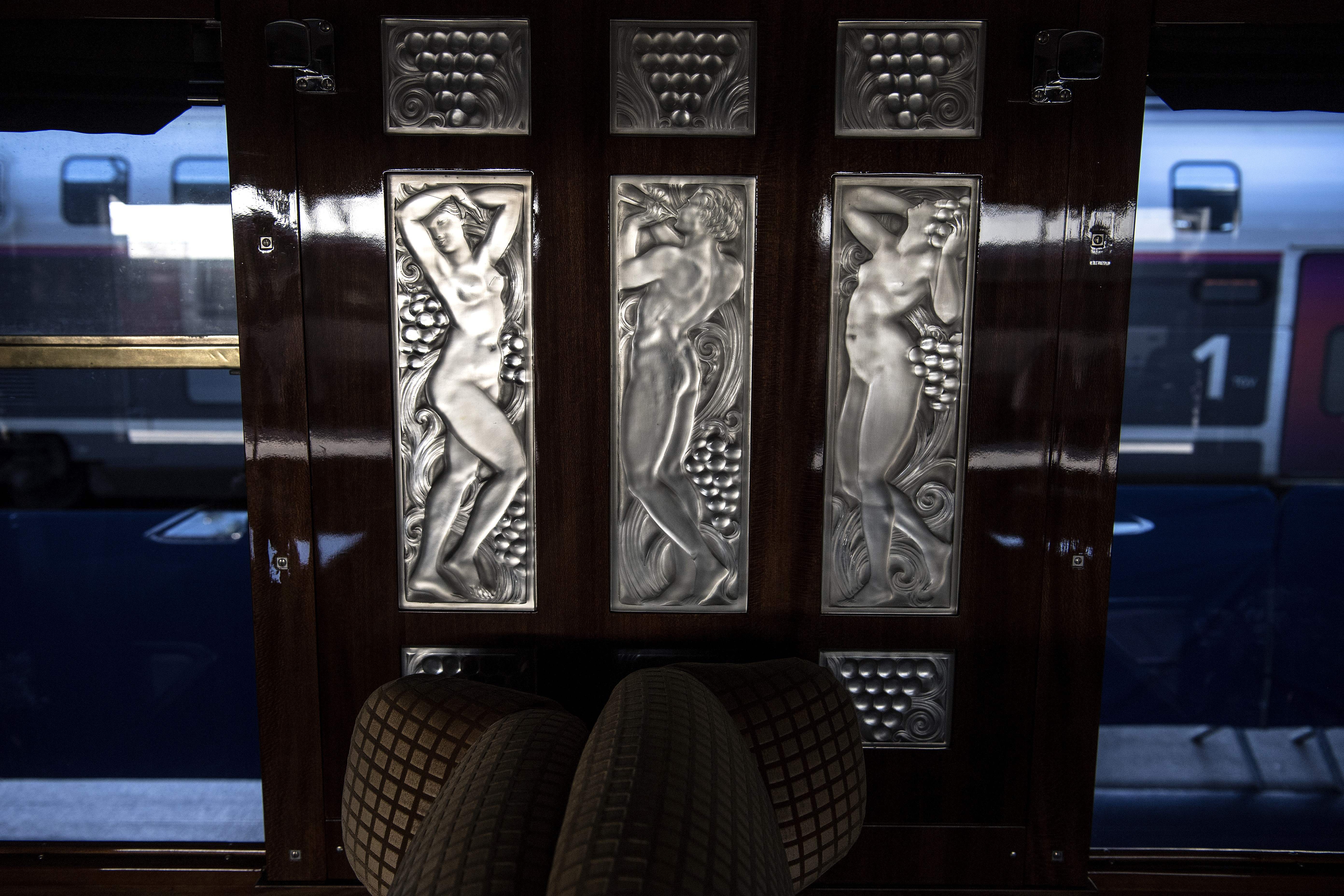 A glass triptych of naiads dancing created by French glass designer Rene Lalique in a restored carriage of an Orient Express train at Gare de l'Est train station in Paris