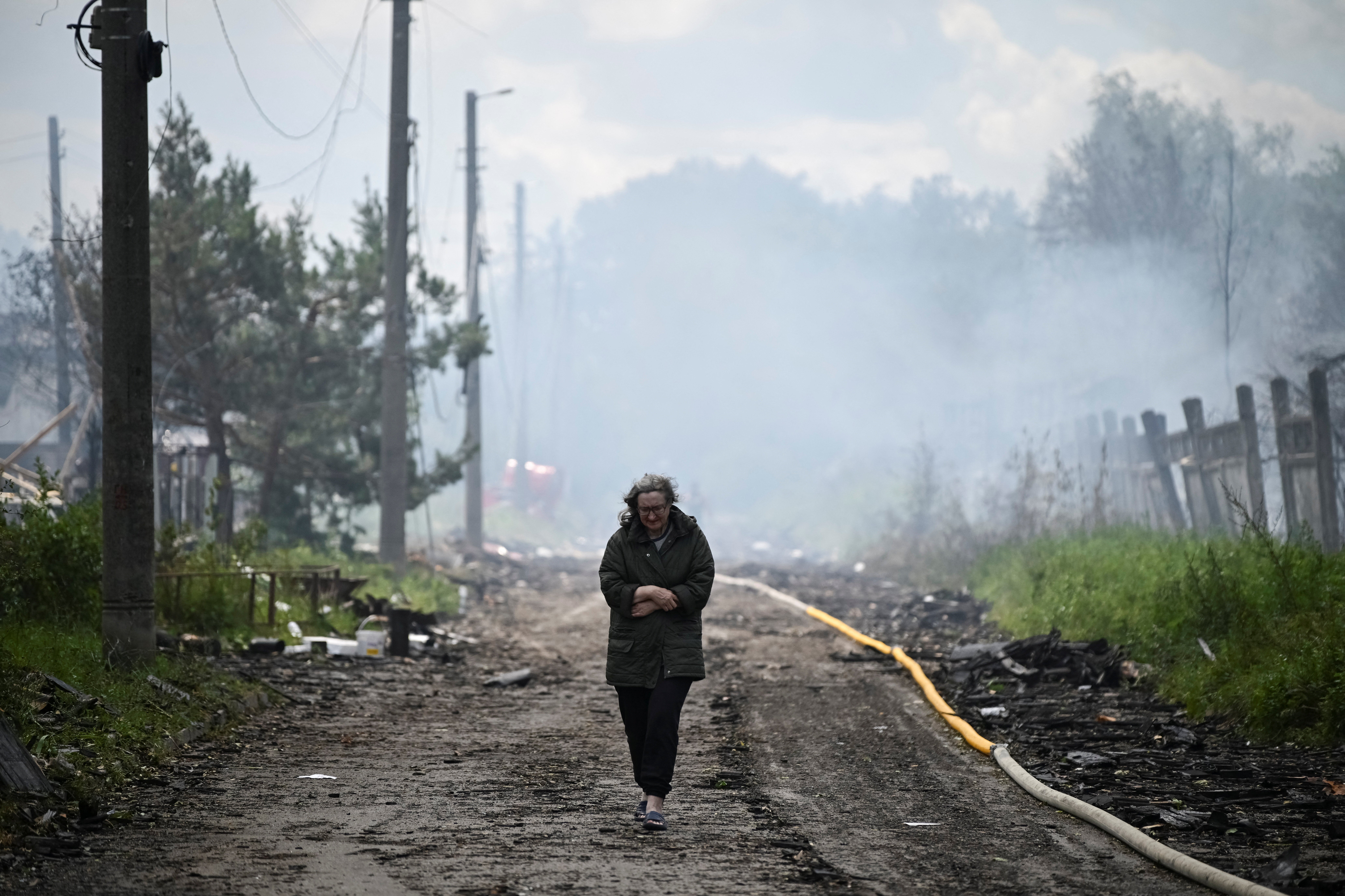 A resident walks on a street at a site of a Russian attack near Kyiv
