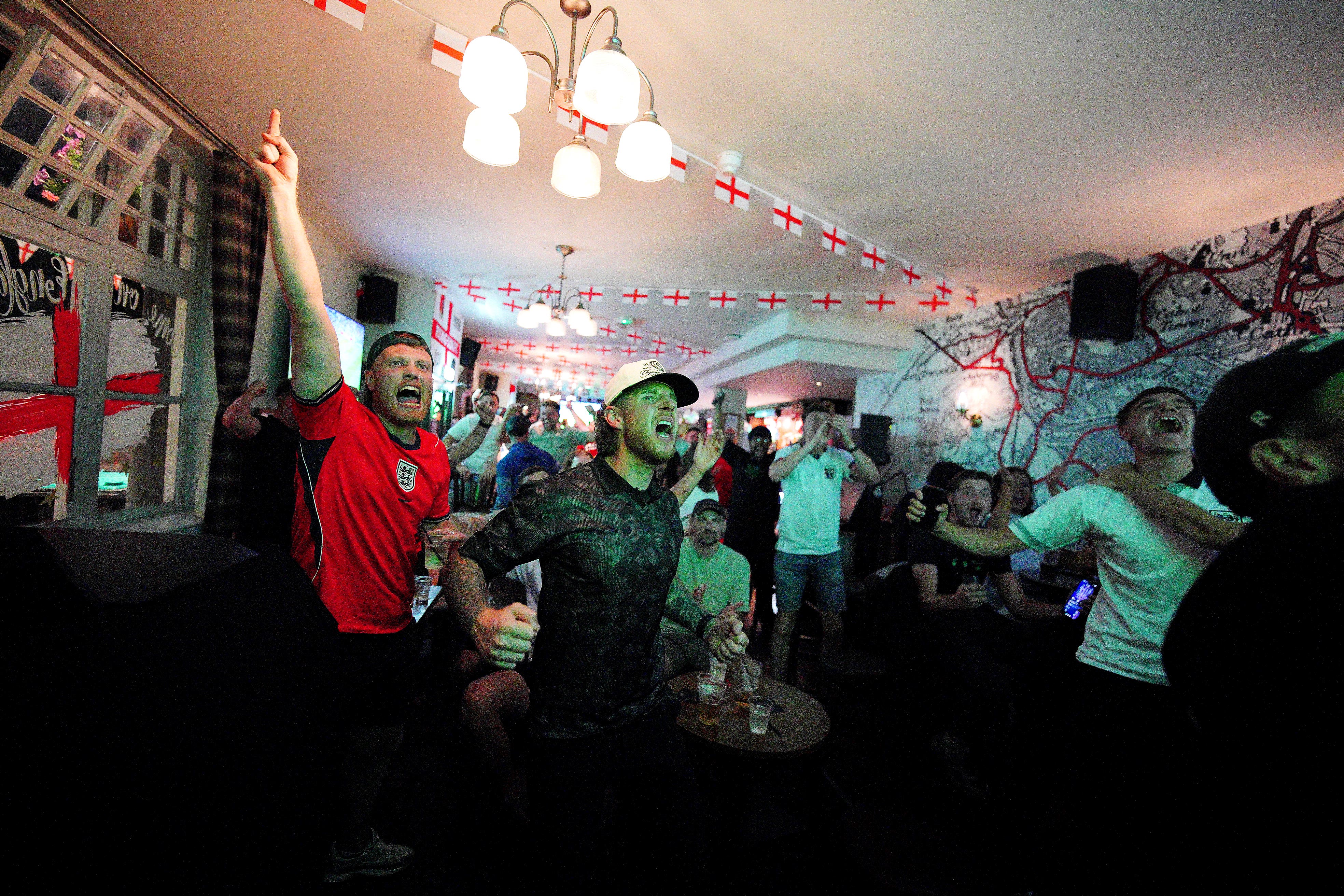 Fans celebrate after watching a screening of the FIFA World Cup match between England and Mexico at The Rising Sun beer garden in Ashton, Bristol (Ben Birchall/PA)