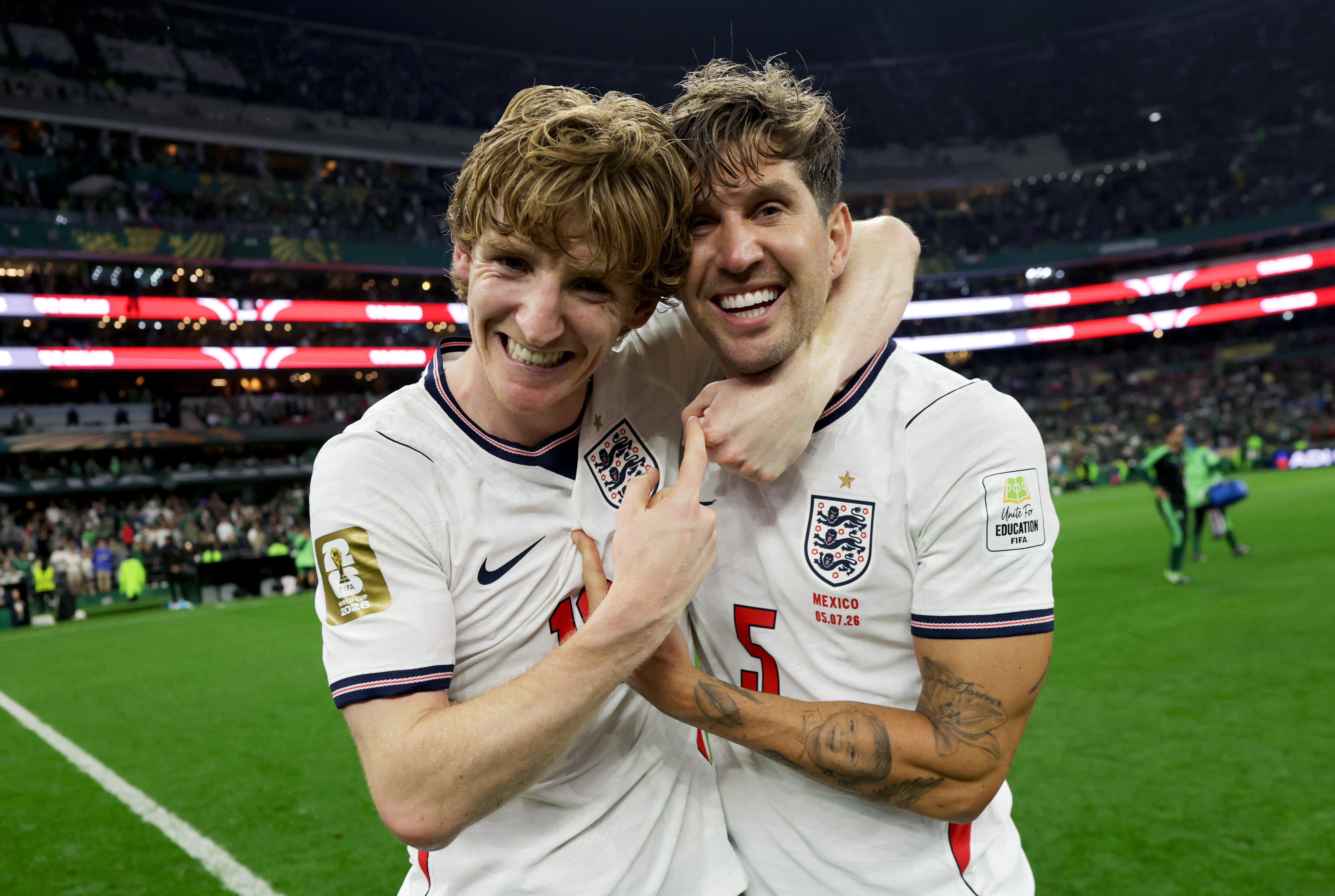 John Stones (right) celebrates England’s win over Mexico with Anthony Gordon