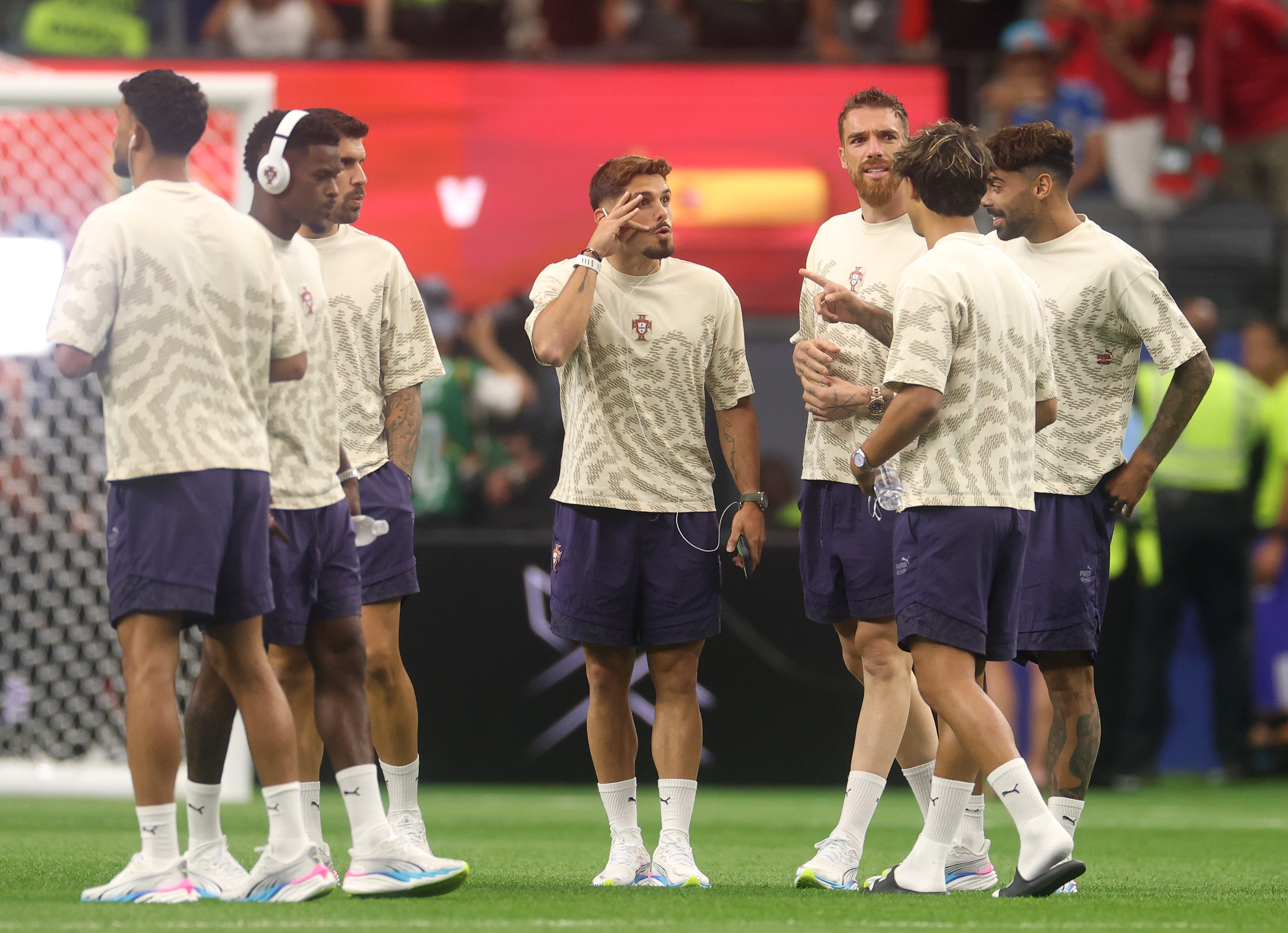 Pedro Neto #18 and Jose Sa #12 of Portugal inspect the pitch (Getty)