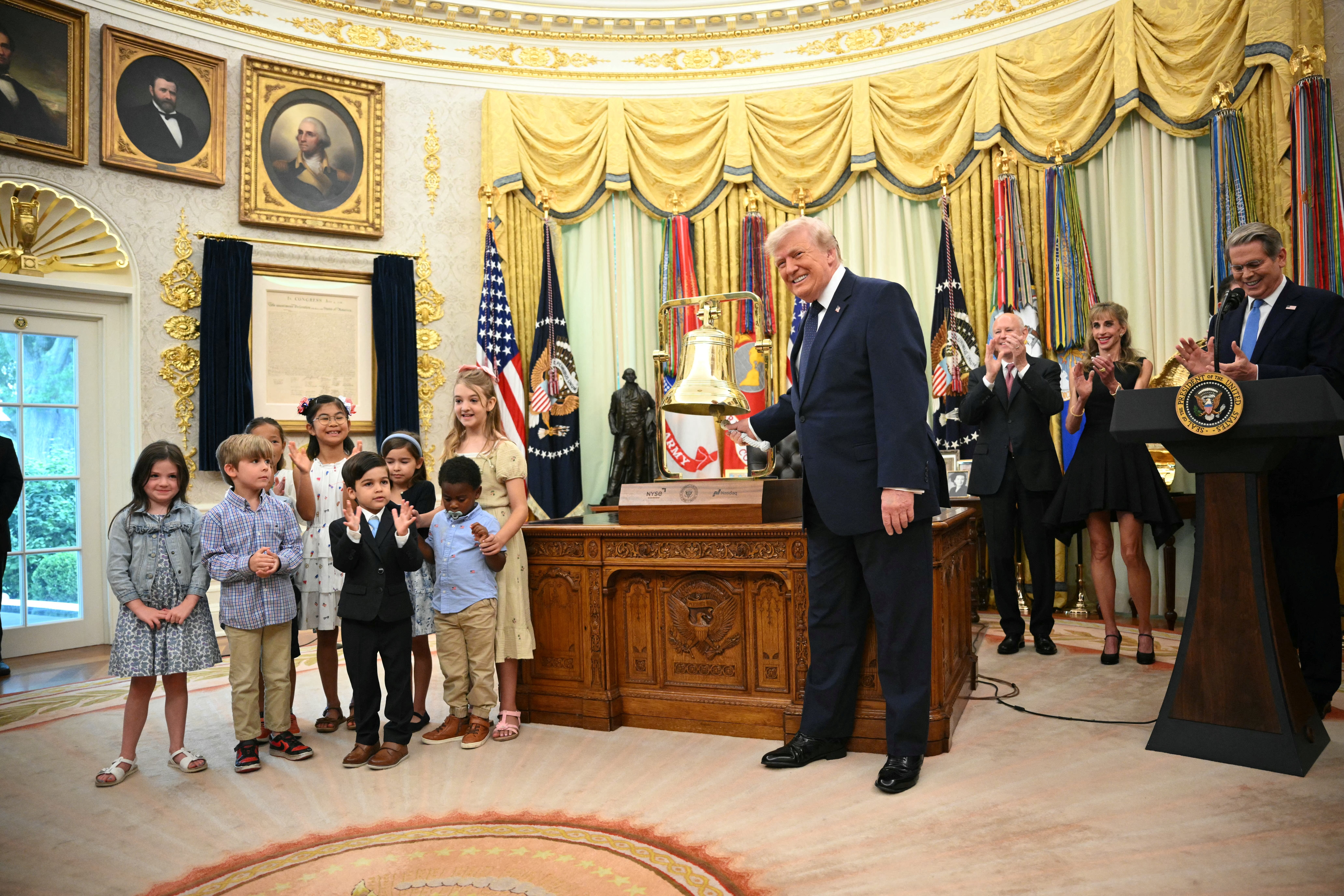 President Donald Trump rings the opening bell of the New York Stock Exchange ahead of the launch of Trump investment accounts in the Oval Office Monday