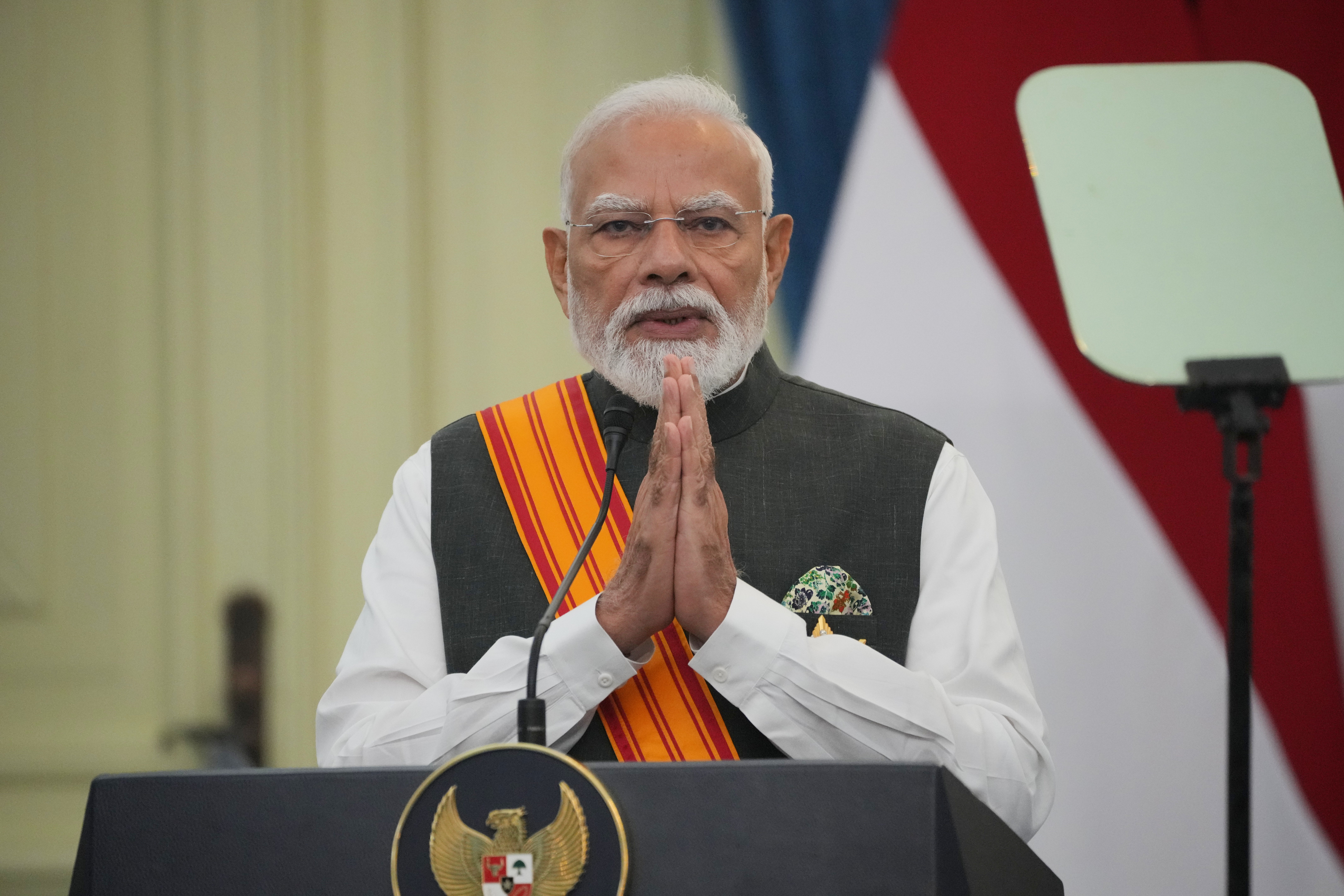 India's Prime Minister Narendra Modi gestures as he speaks during a joint press conference with Indonesia's President Prabowo Subianto following their meeting, at Merdeka Palace in Jakarta, Indonesia, Tuesday (AP)
