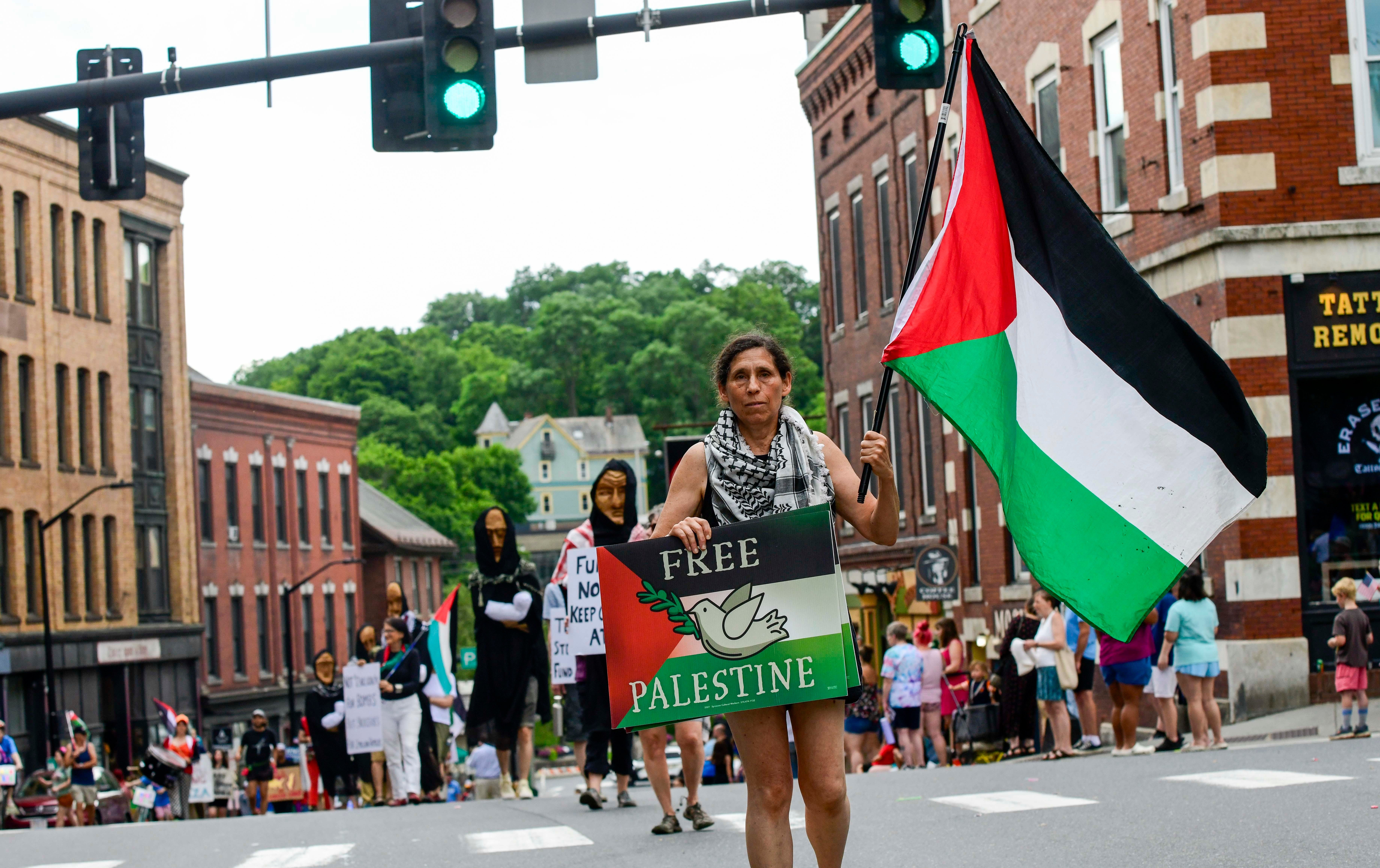 Shana Frank leads a group of protesters in a "Free Palestine" march as part of the Fourth of July parade in Brattleboro, Vermont, on July 4