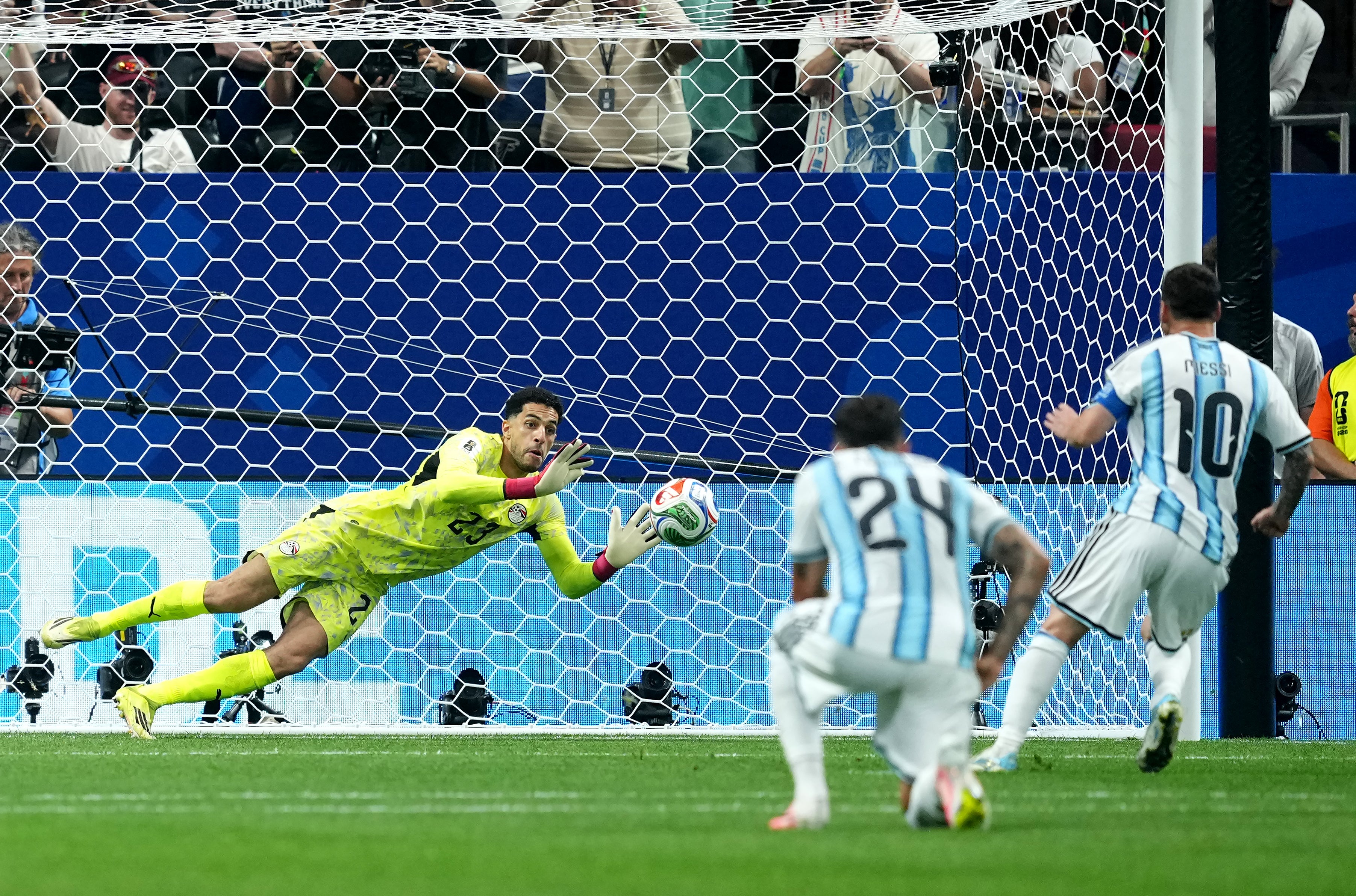 Argentina's Lionel Messi (right) has a penalty saved by Egypt goalkeeper Mohamed Shobeir