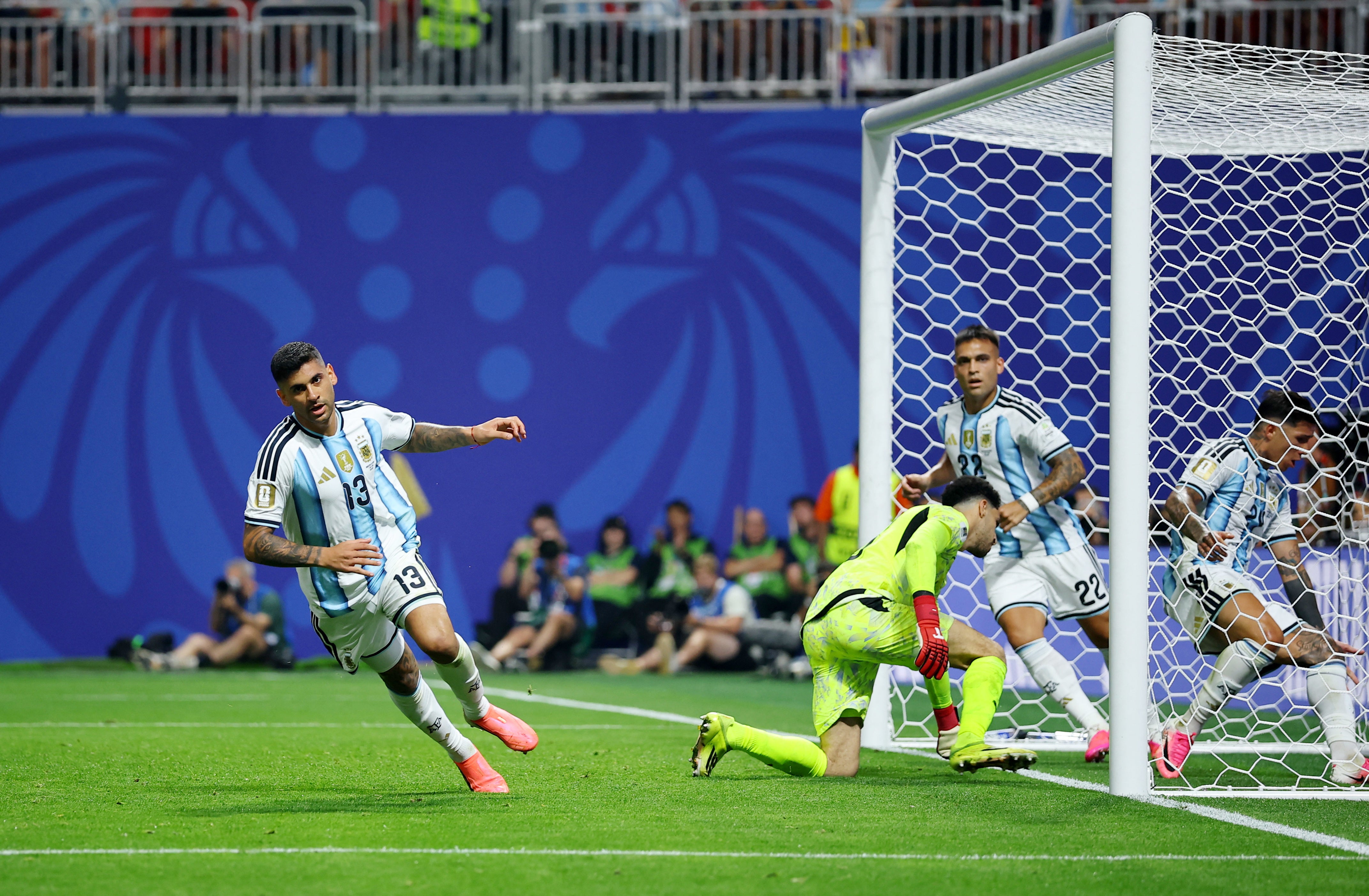 Argentina's Cristian Romero celebrates scoring their first goal