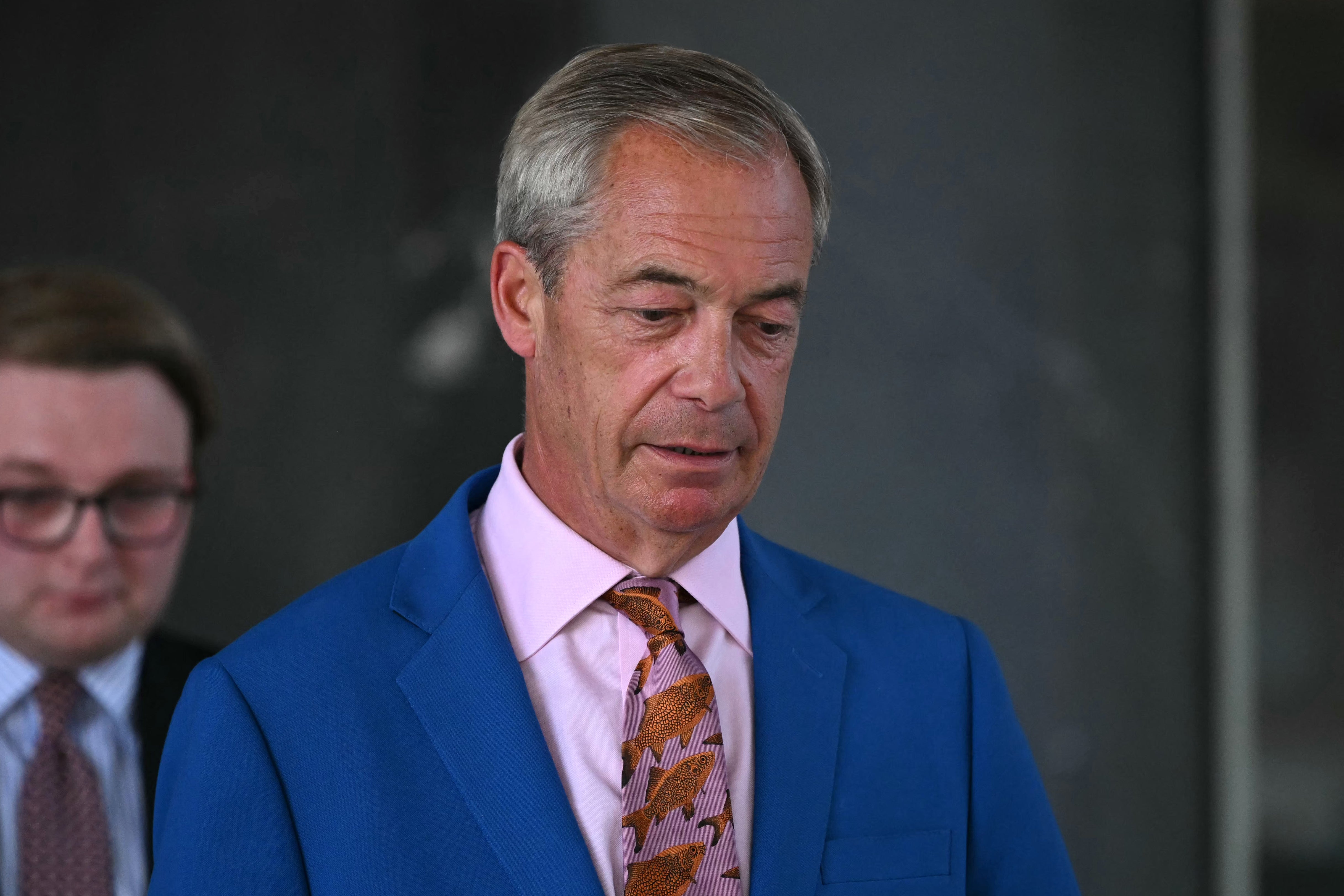 Reform UK Leader Nigel Farage leaves Millbank Tower after making a televised speech in which he resigned as MP for Clacton