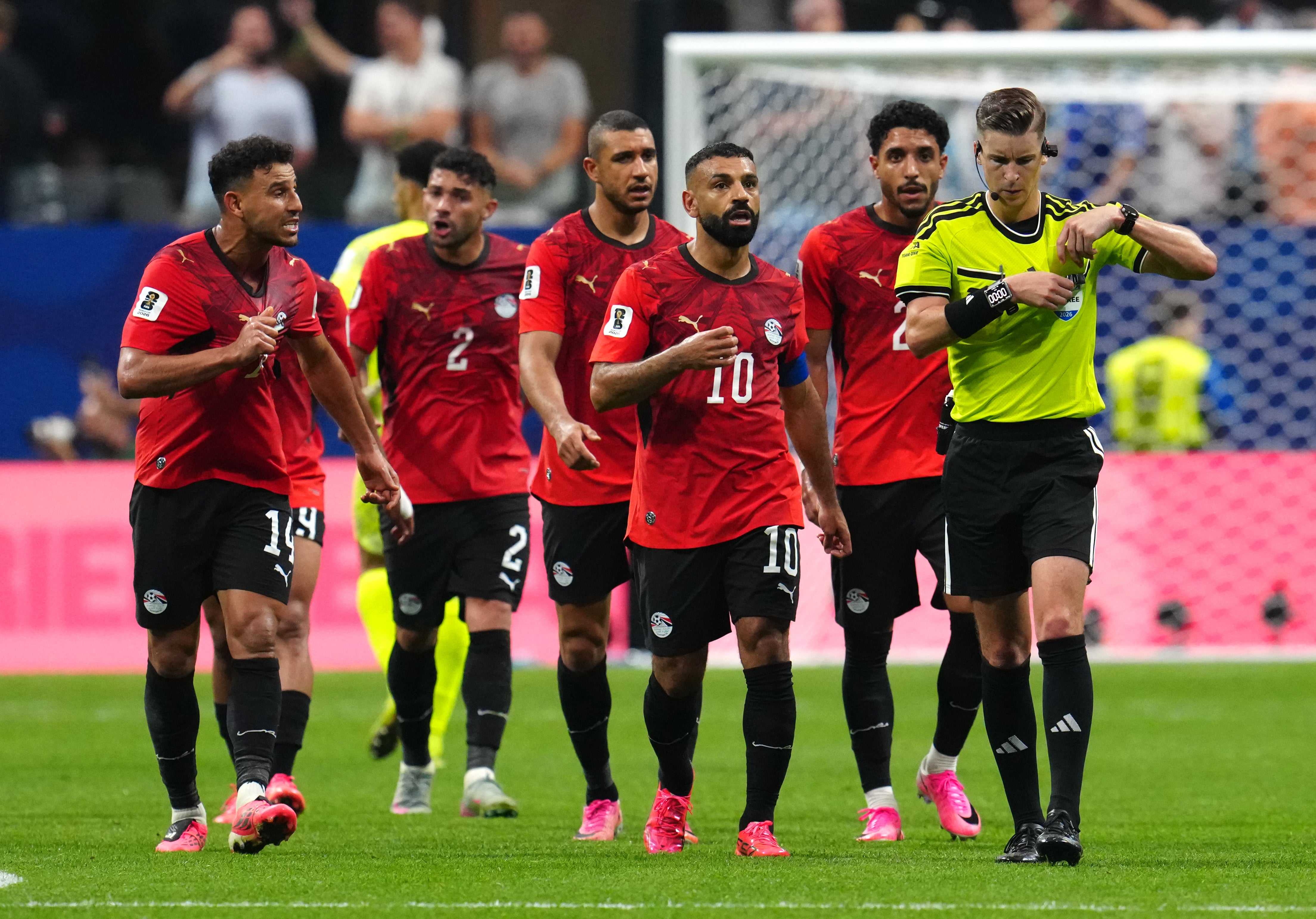 Egypt players appeal to referee Francois Letexier after Argentina's third goal