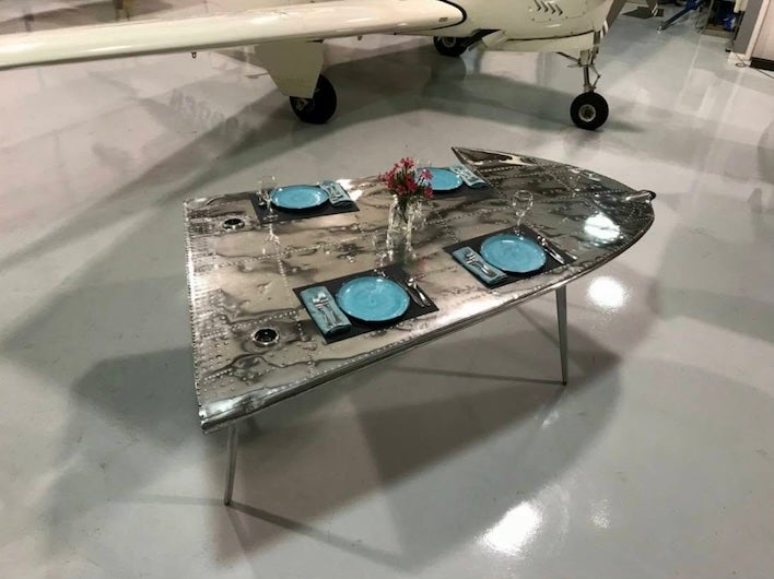 One of the coolest antiques that Ross has collected in his 60 years in the business is an airplane wing from a 1939 DC-3 Gooney Bird that was made into a dining room table