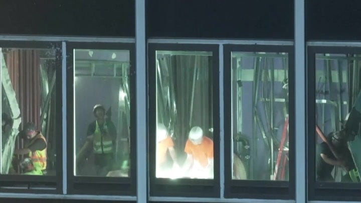 Crews work to reinforce buckled support beams at NYC high-rise