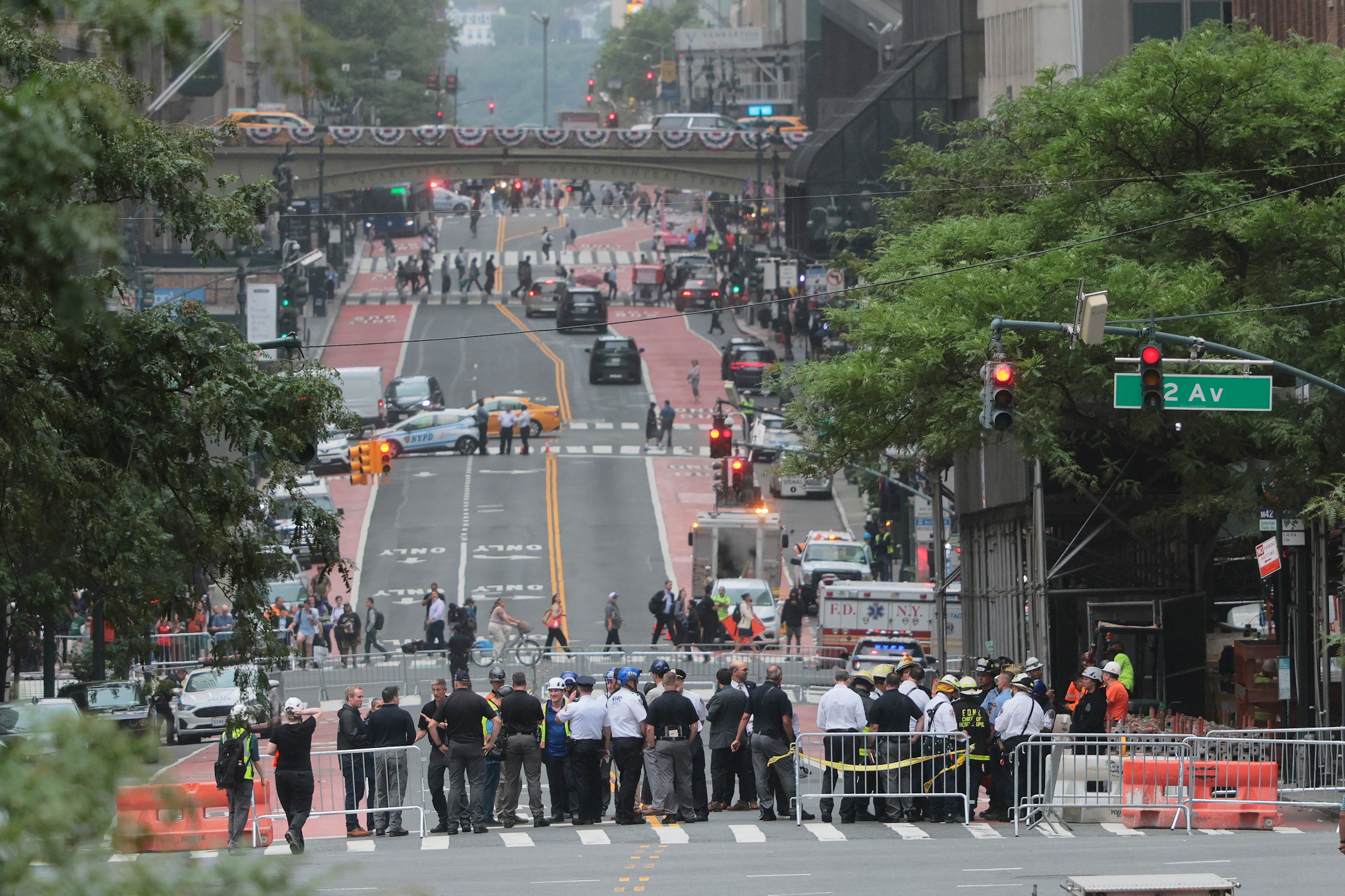 Authorities have partially or fully evacuated five buildings, and traffic has been blocked off from accessing a perimeter spanning multiple blocks. Police barricades are pictured in the area on Tuesday