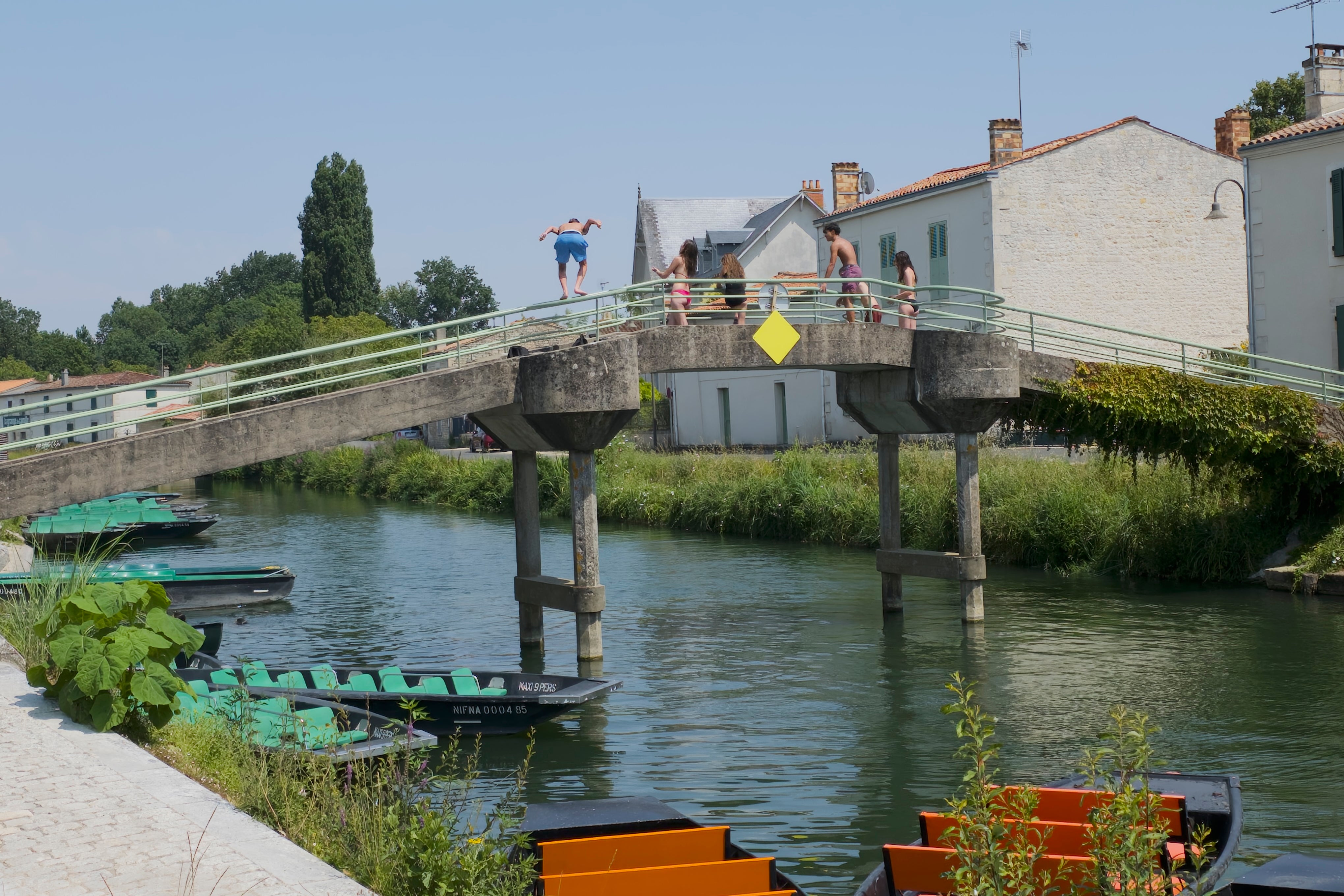 Local children jumping off a bridge at Coulon in France (Anna Richards)