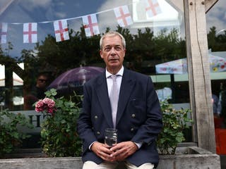 Nigel Farage sits at a pub, after he announced on Tuesday that he has resigned as an MP